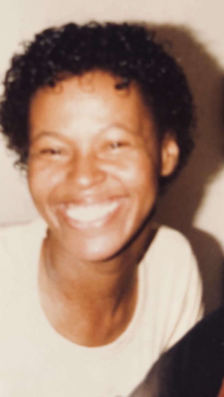 A close-up of a woman smiling