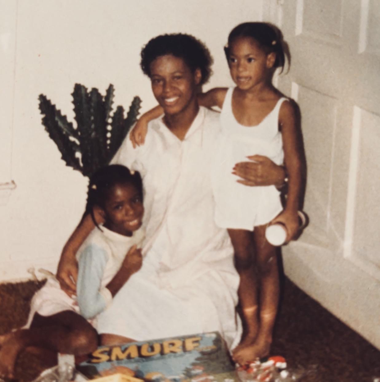 A woman and two children posing for a picture