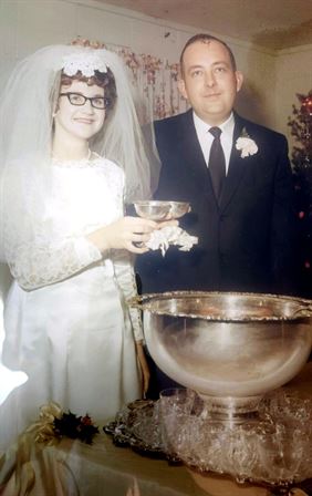A man and woman in wedding attire