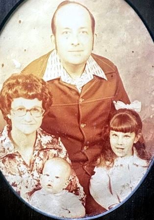 A man and woman with children