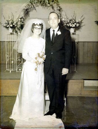 A man and woman in wedding attire