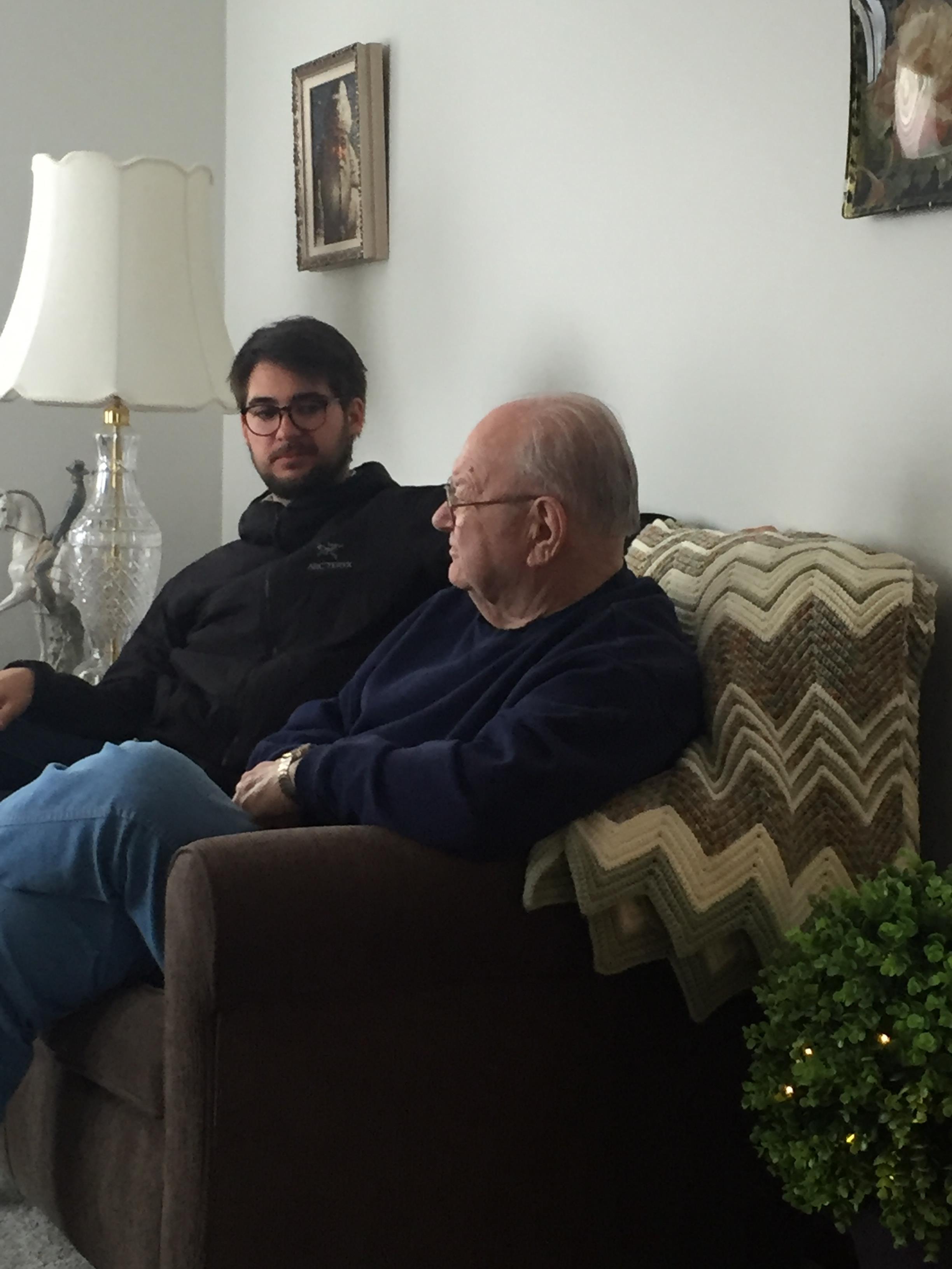 Two men sitting on a couch
