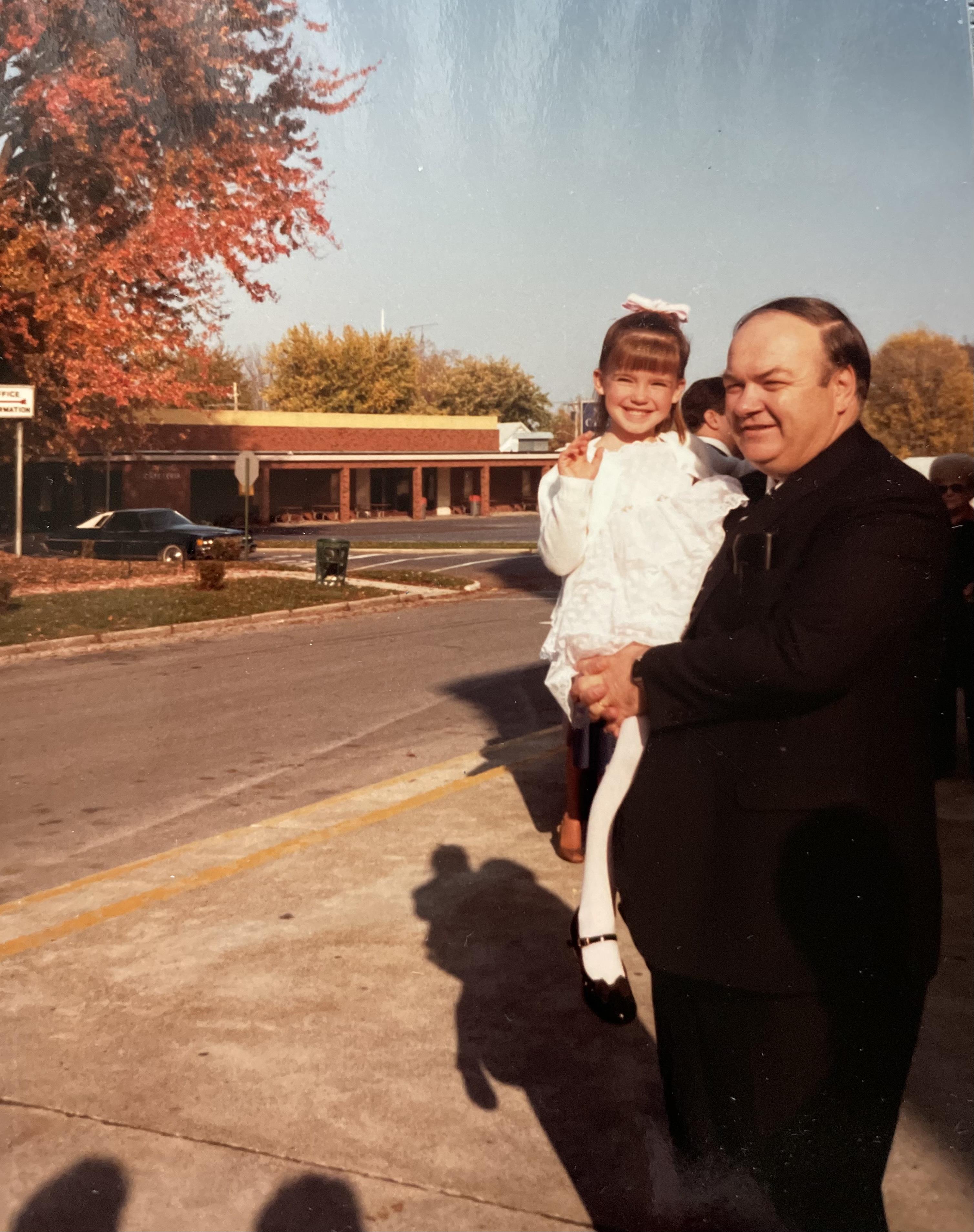 A man holding a girl