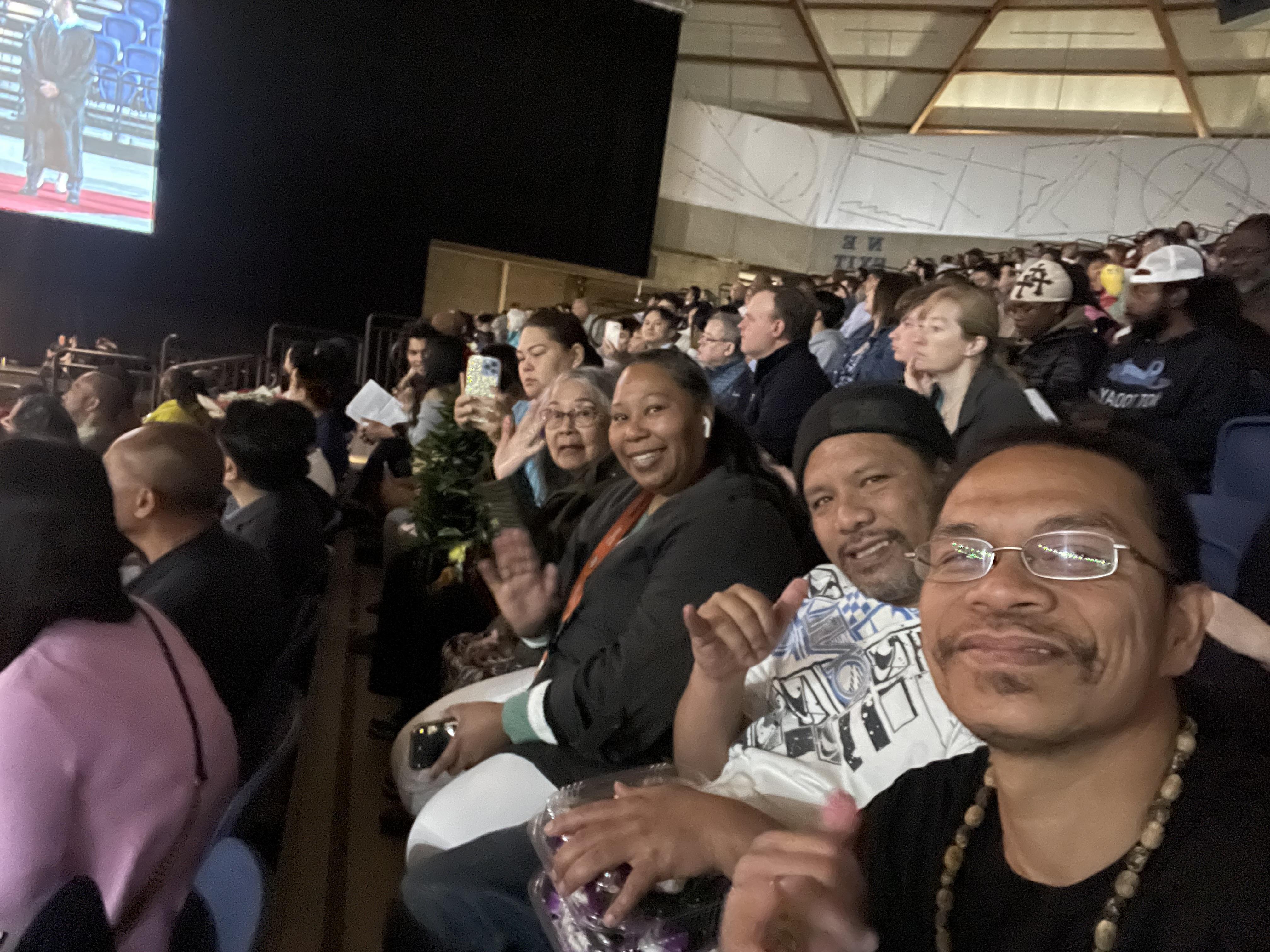 A group of people sitting in a stadium