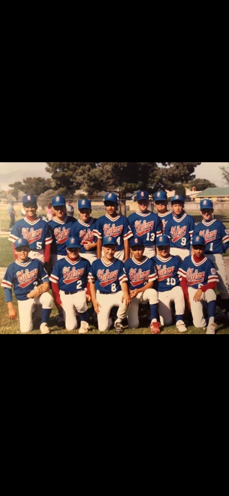 A group of baseball players posing for a photo