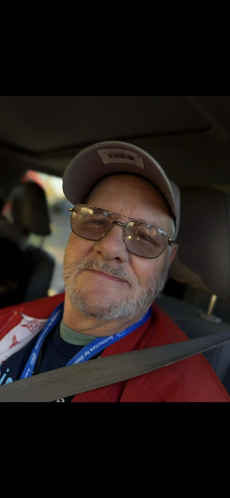 A man in a hat and glasses