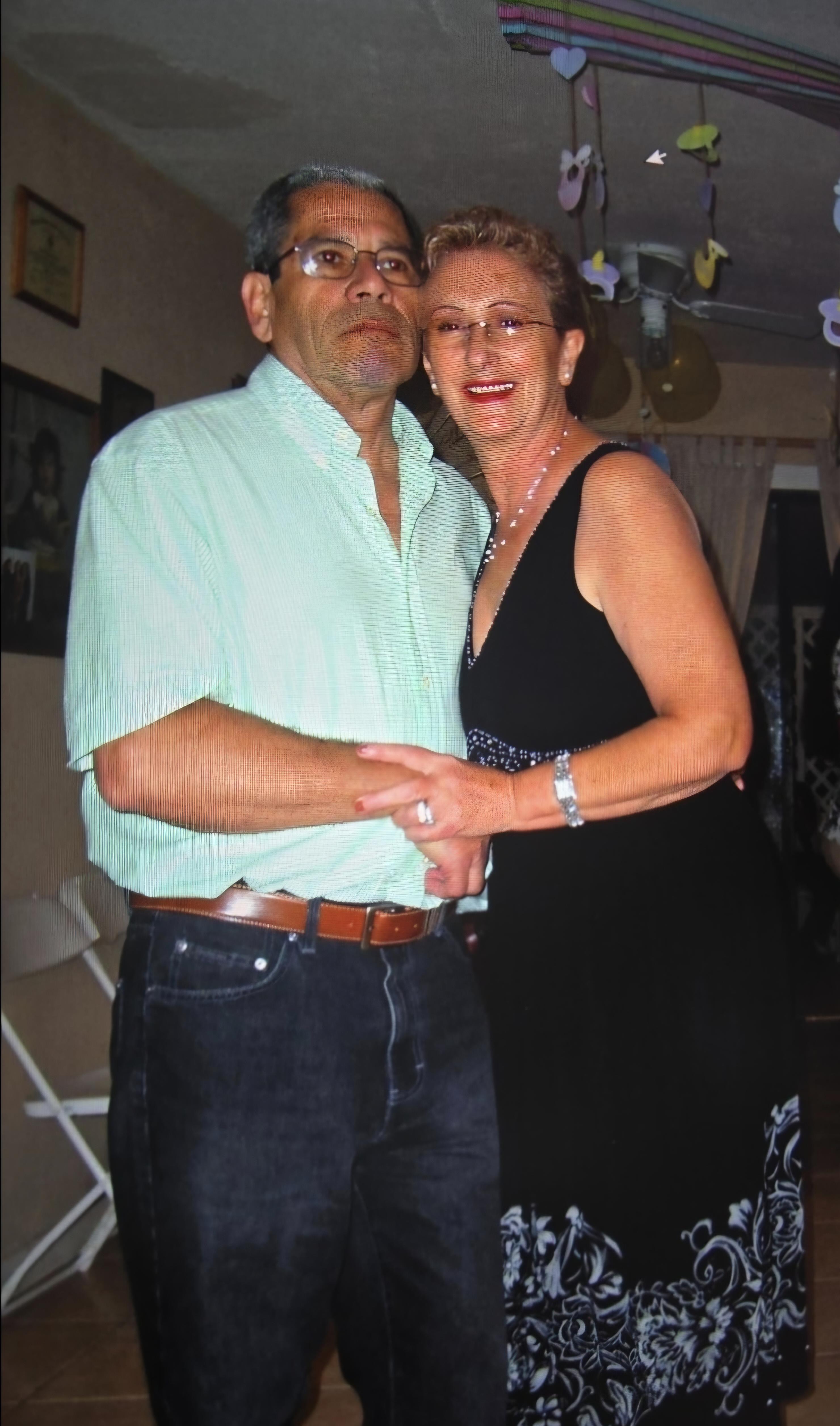 A man and woman posing for a picture