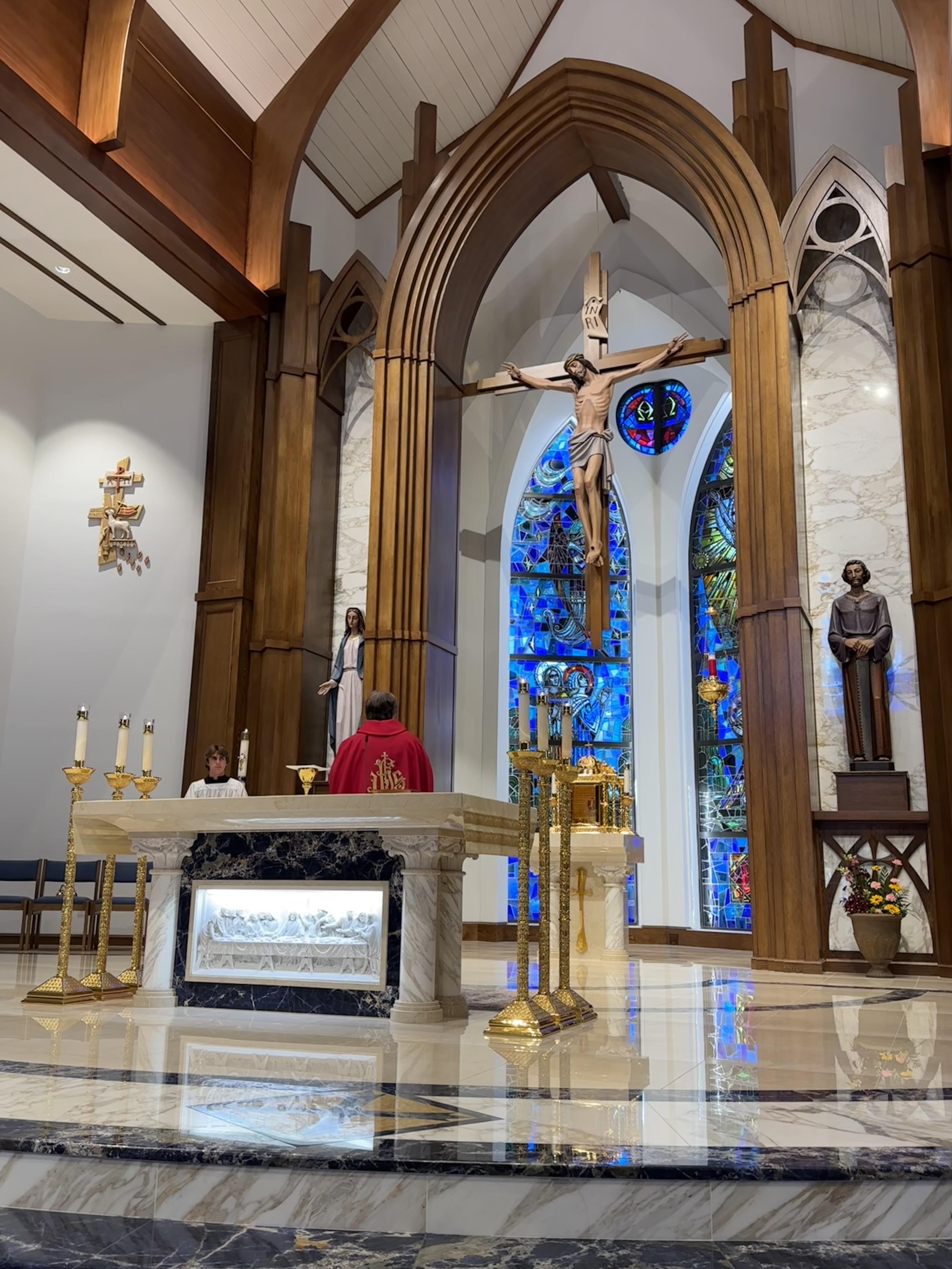 A church with a cross and a stained glass window