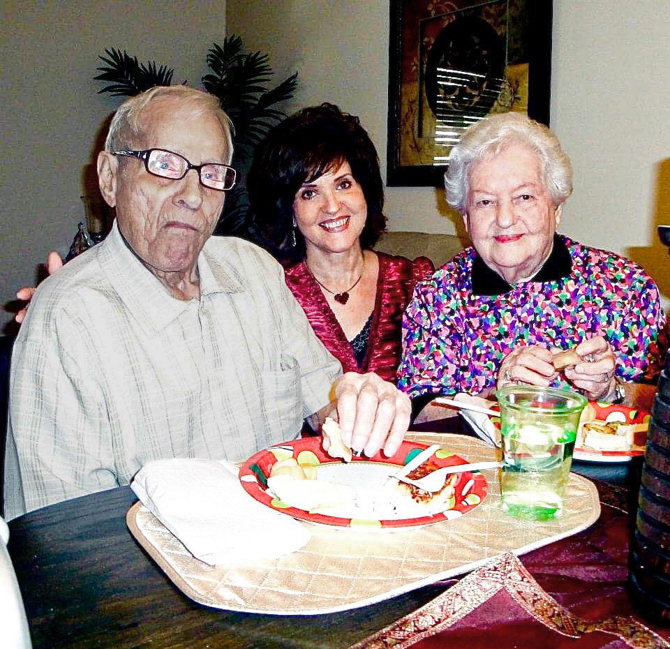A group of people sitting at a table eating
