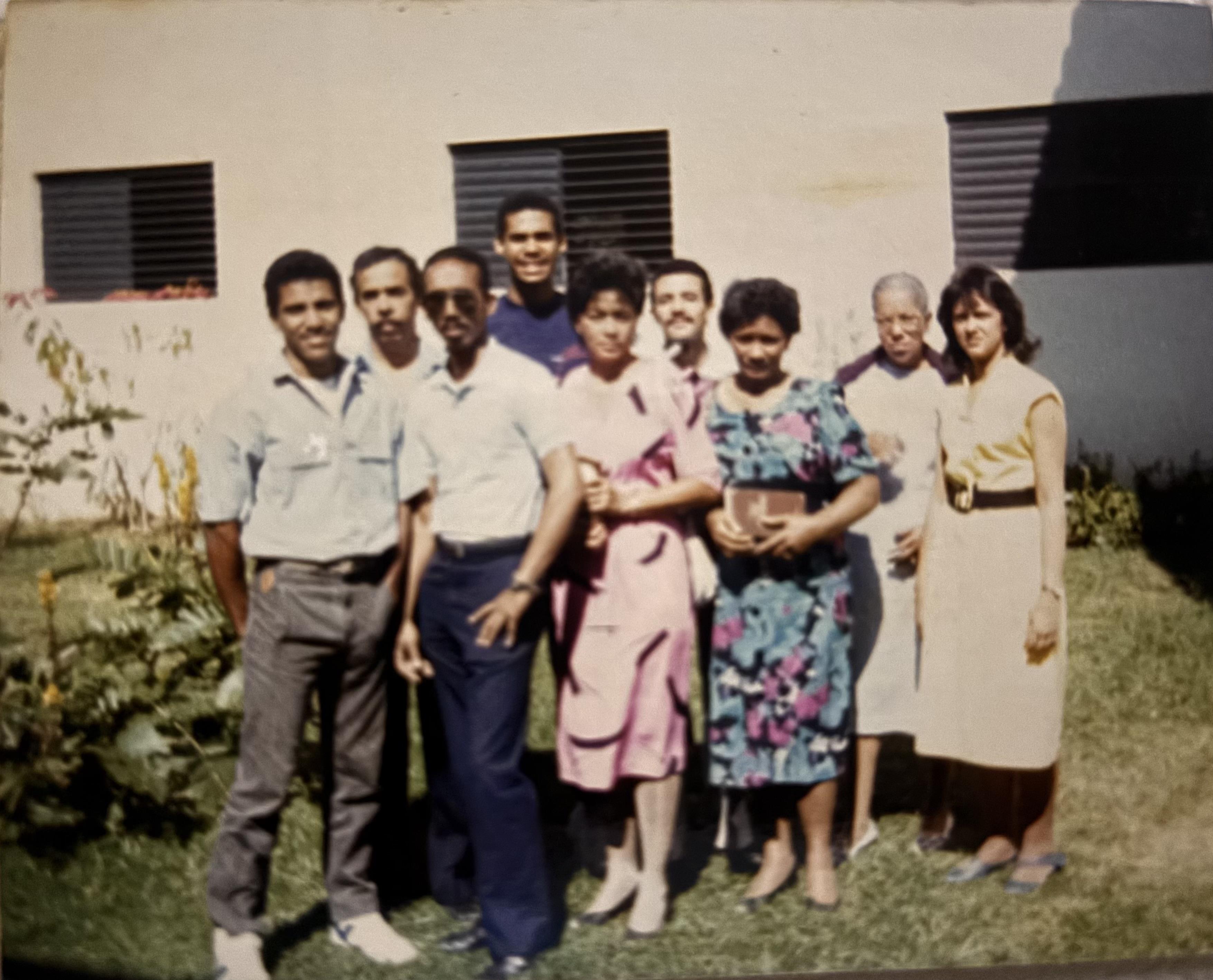 A group of people standing in front of a building