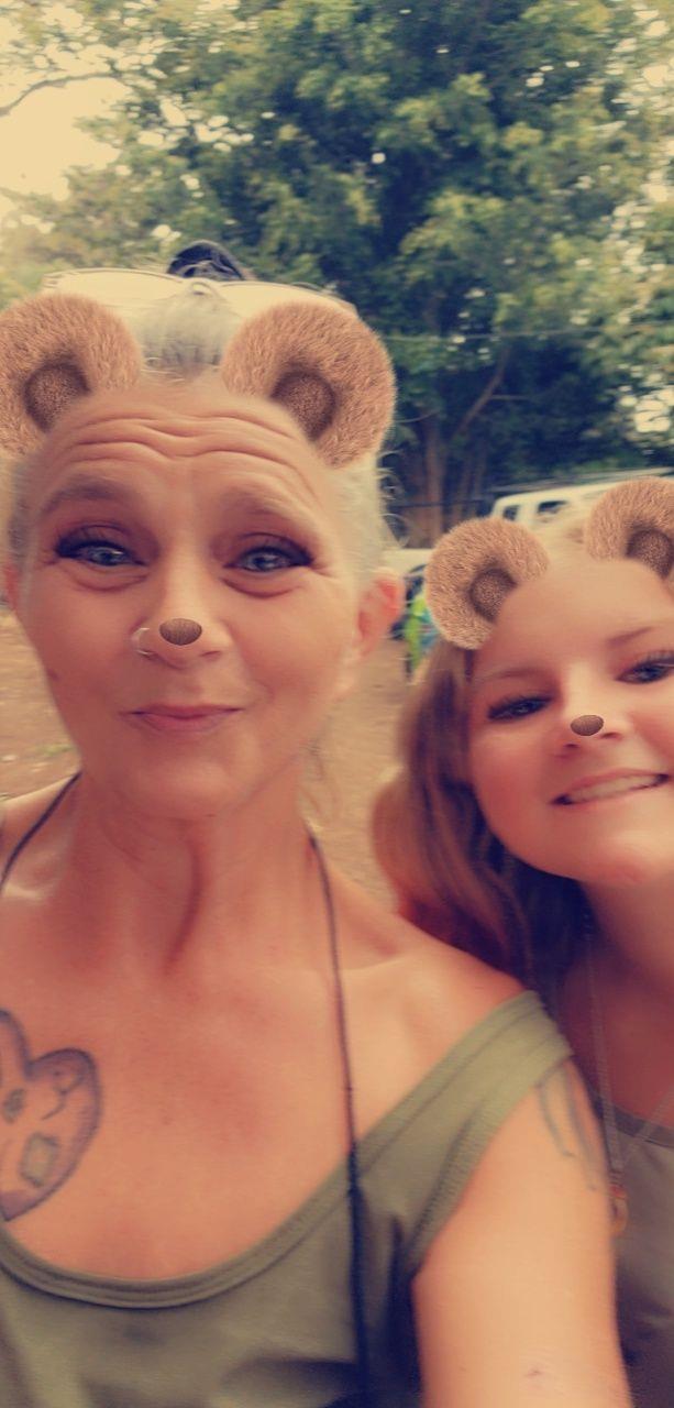 A woman and a girl taking a selfie