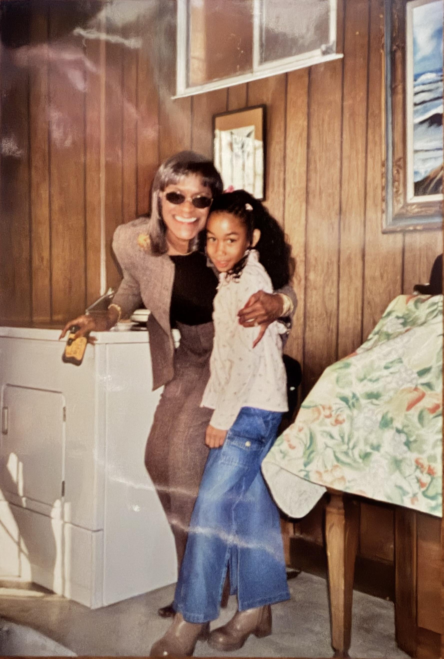 A woman and a child posing for a picture
