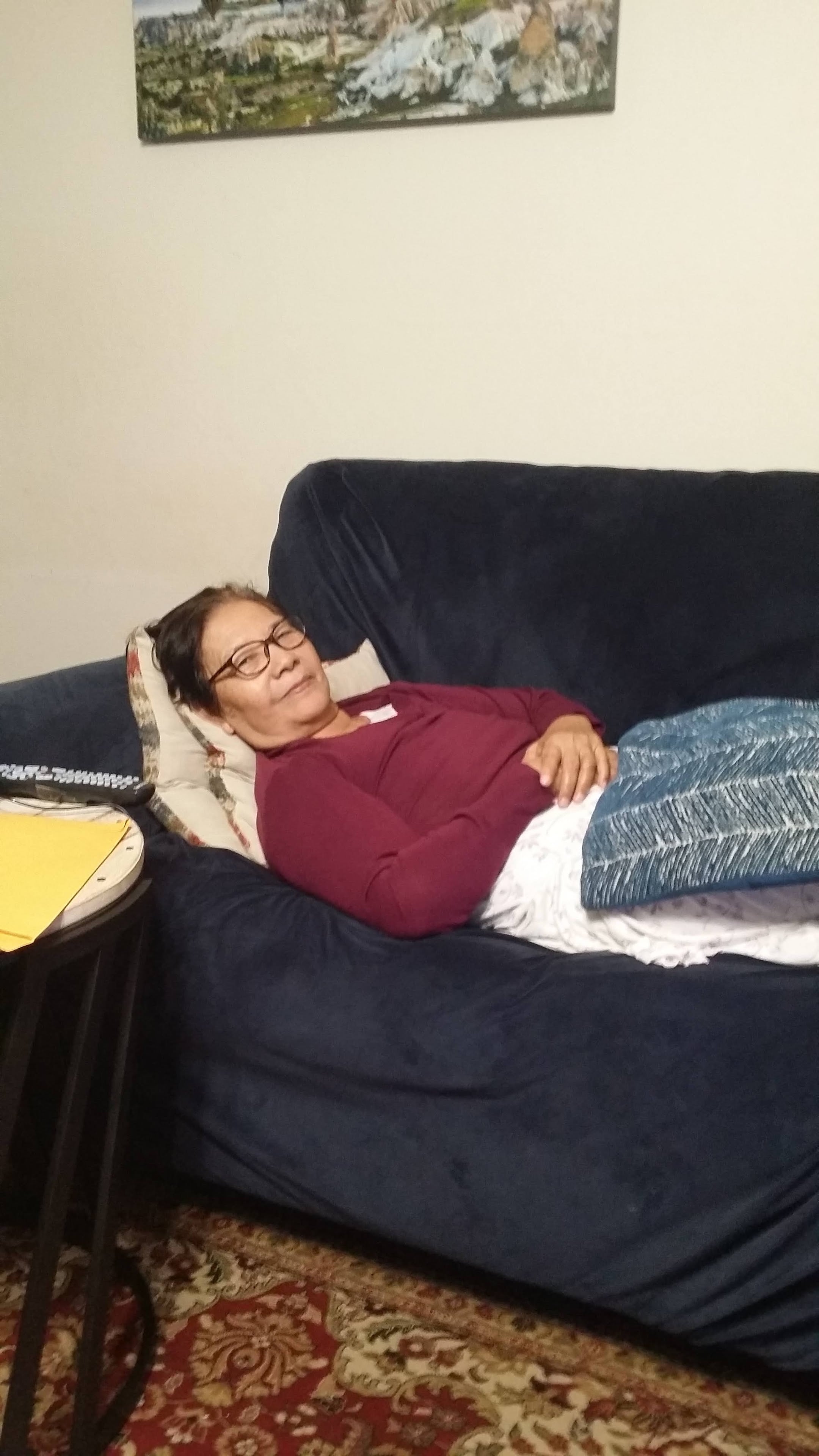 A woman lying on a couch