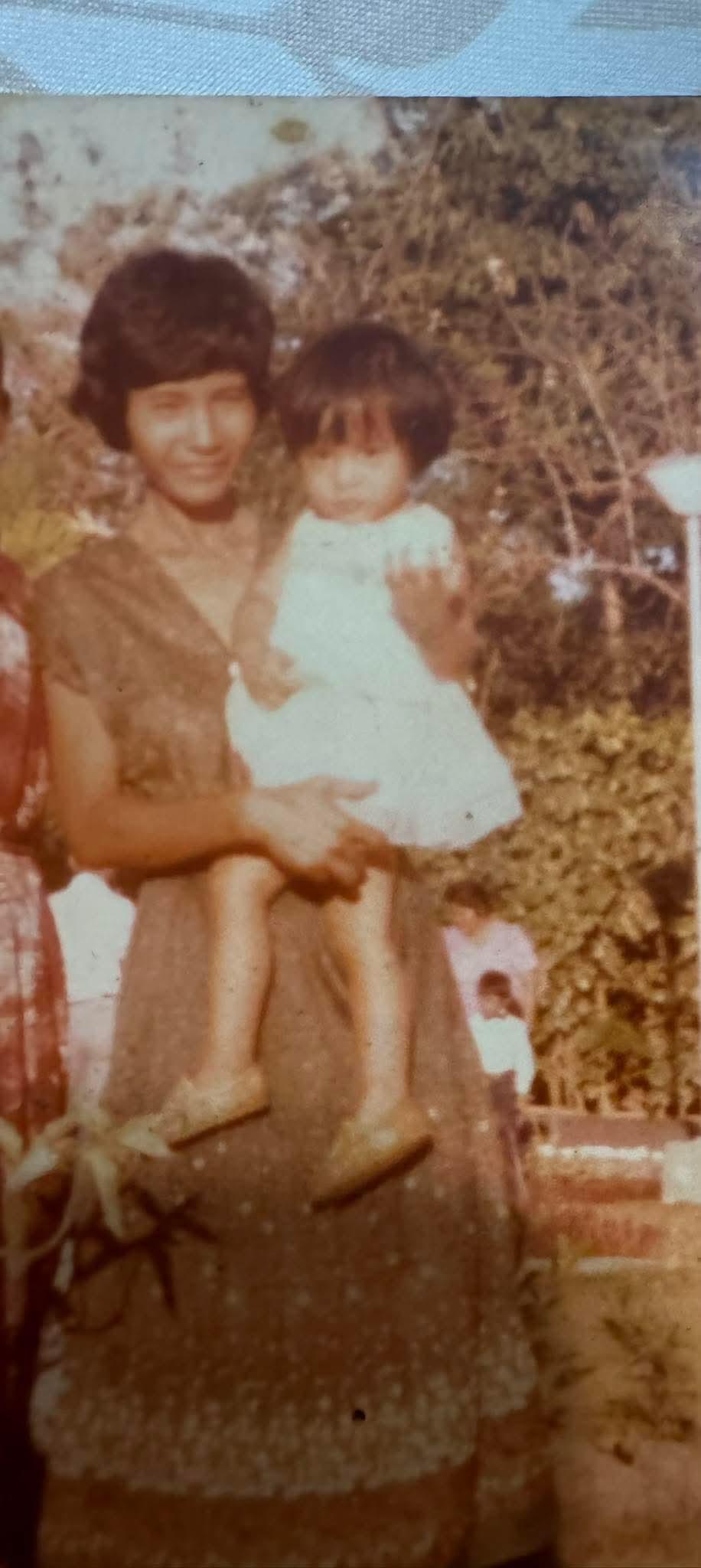 A woman holding a baby