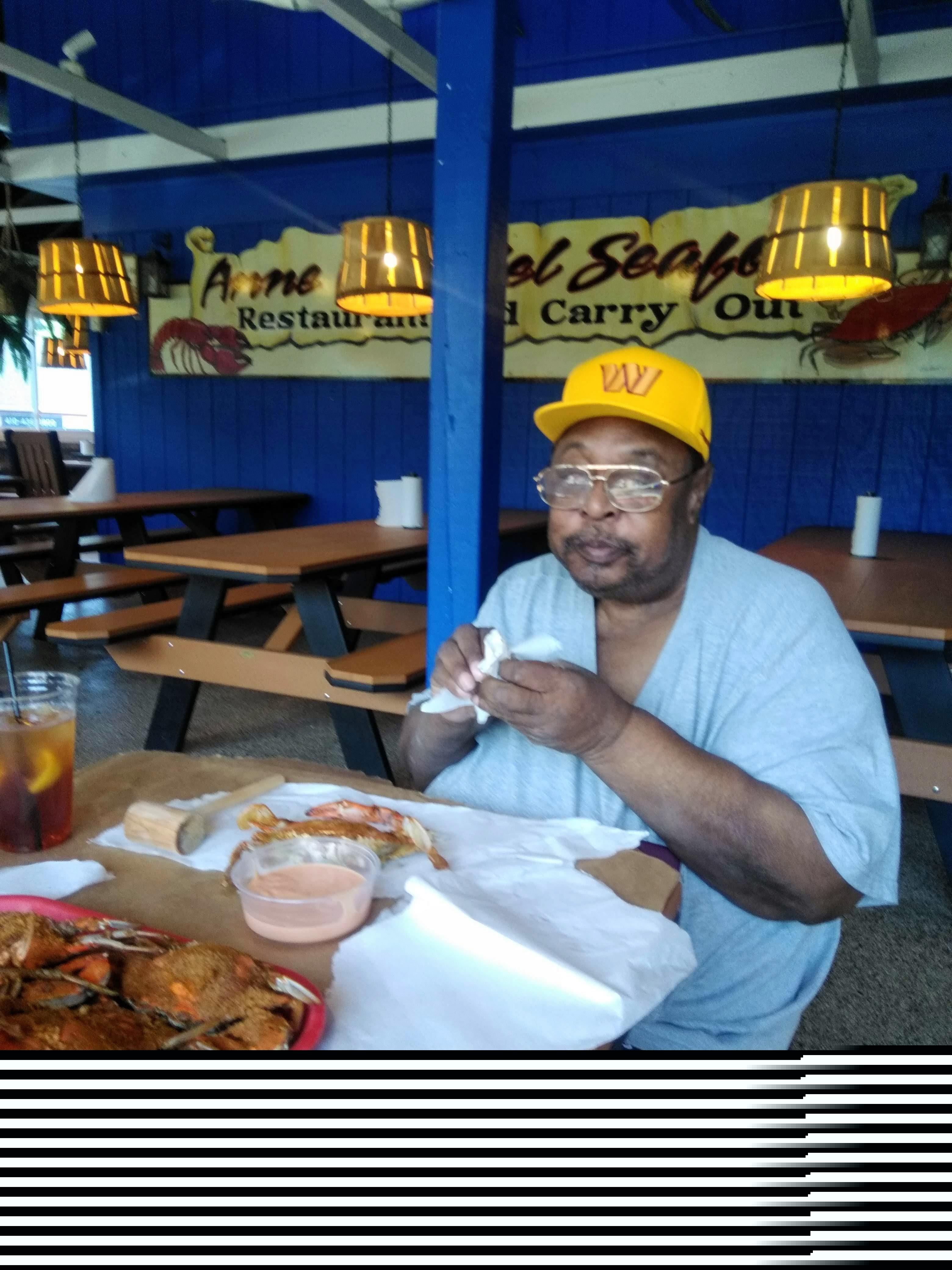 A man eating at a restaurant