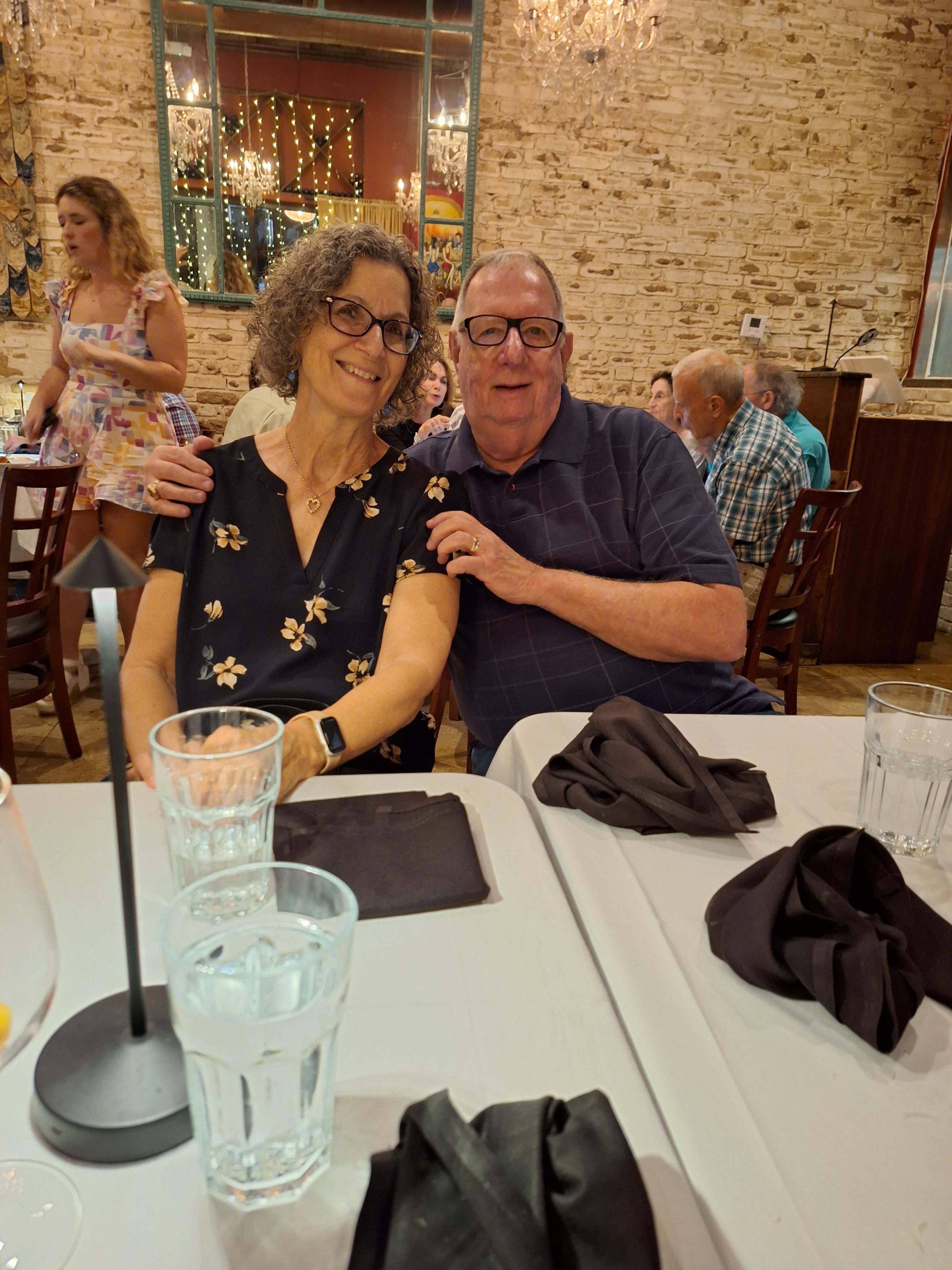 A man and woman sitting at a table