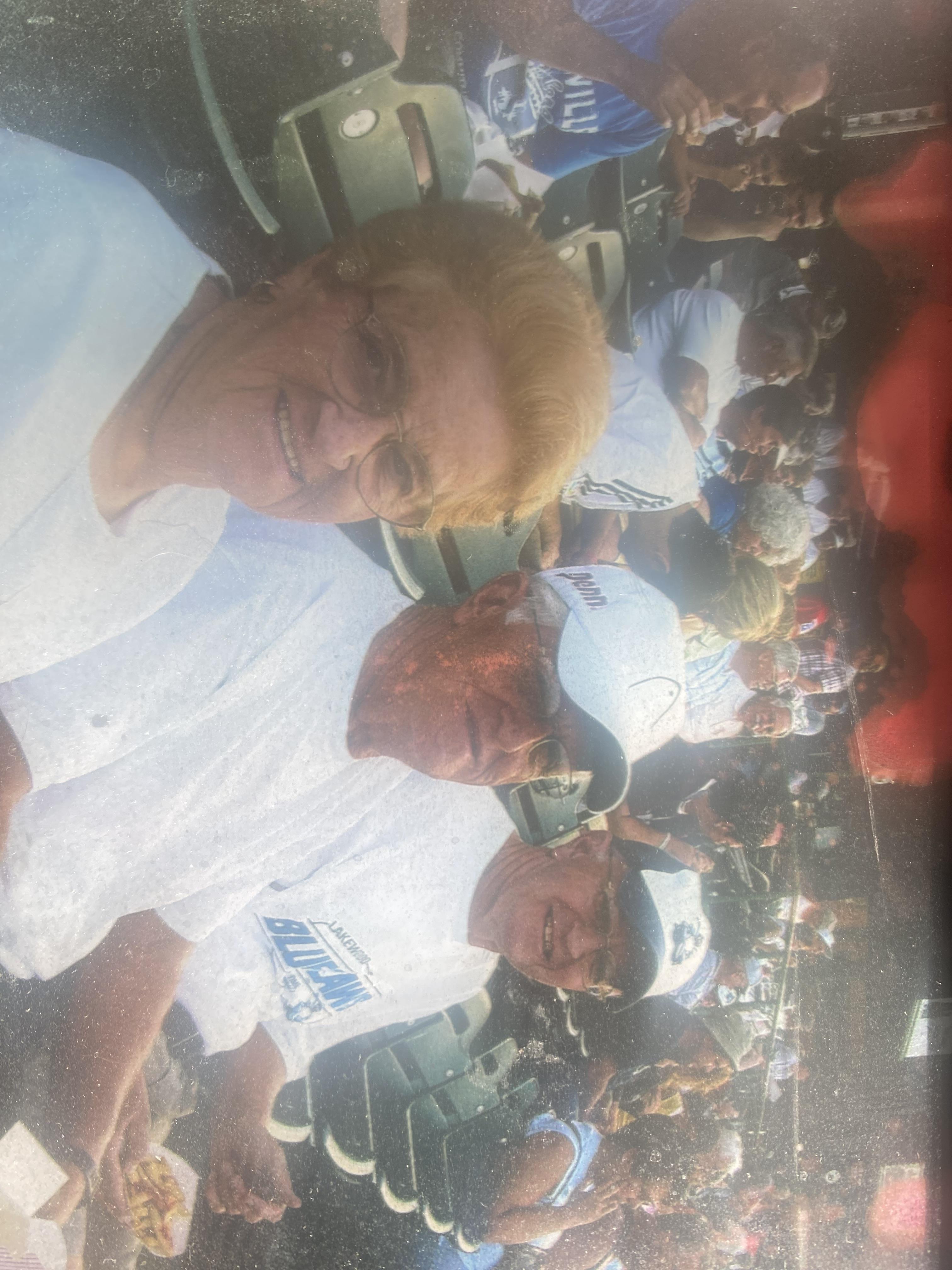 A group of men in white shirts