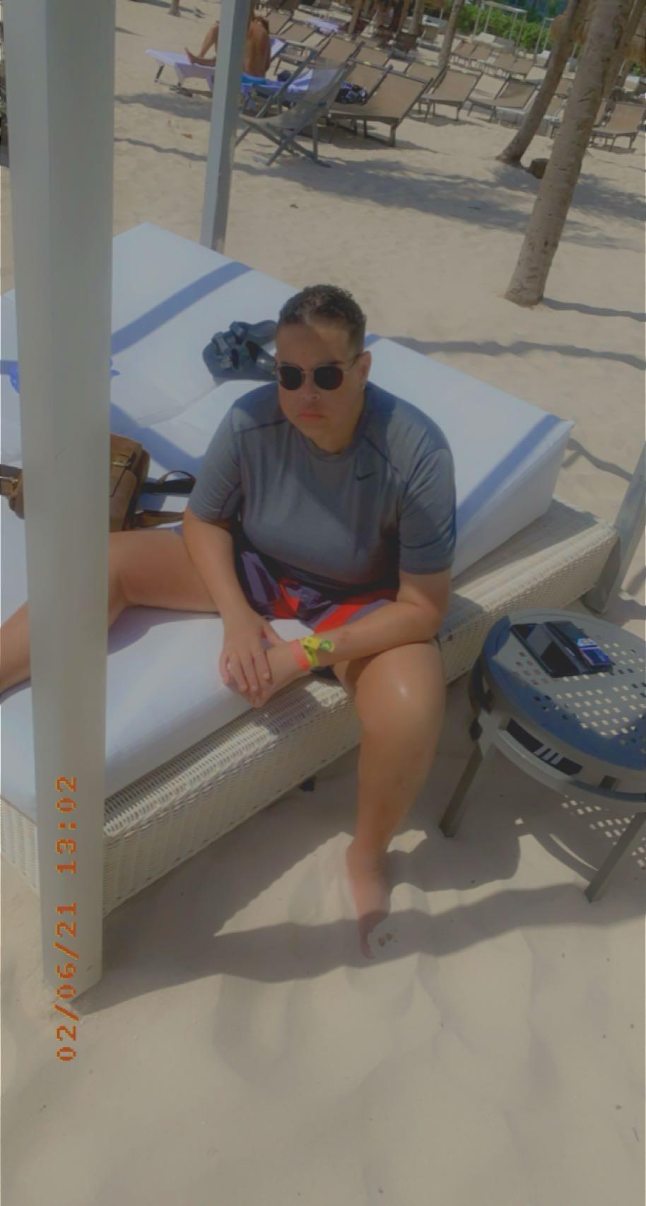A man sitting on a beach chair