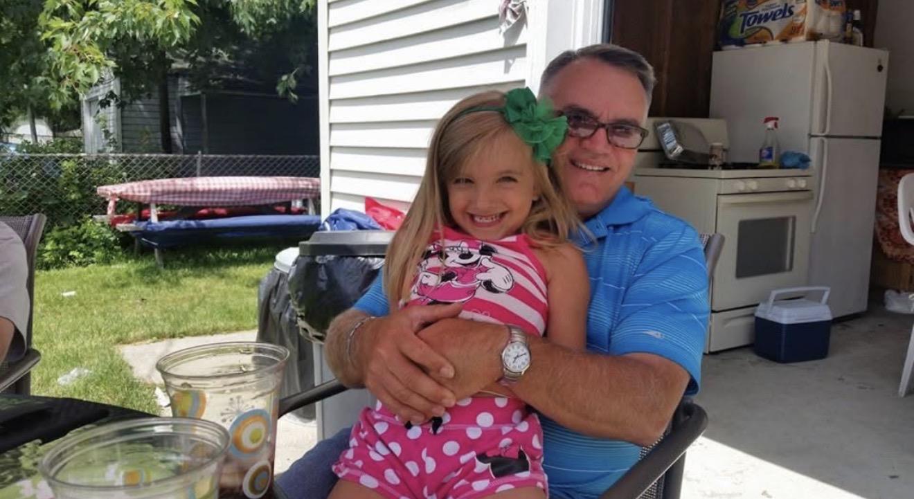 A man holding a girl