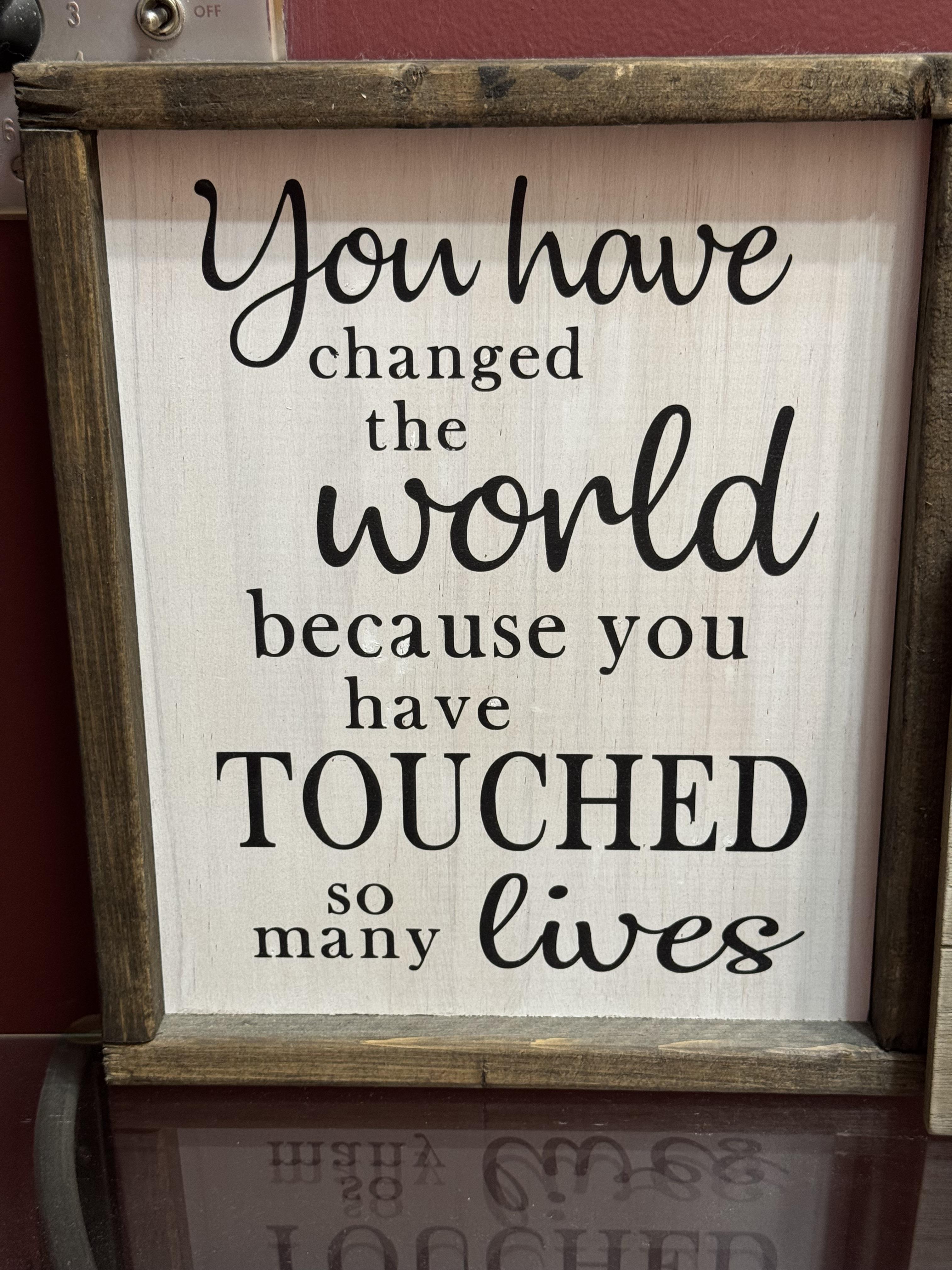 A sign with black text
