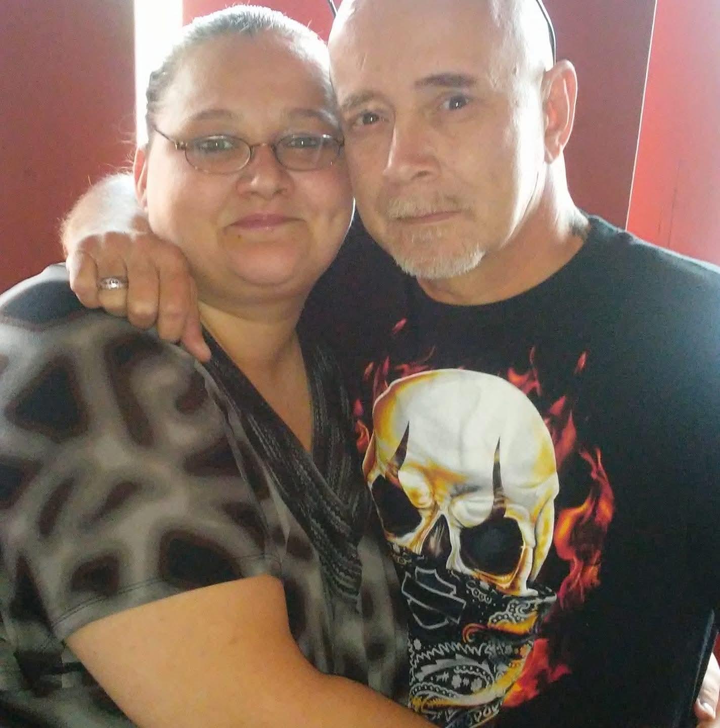 A man and woman posing for a picture