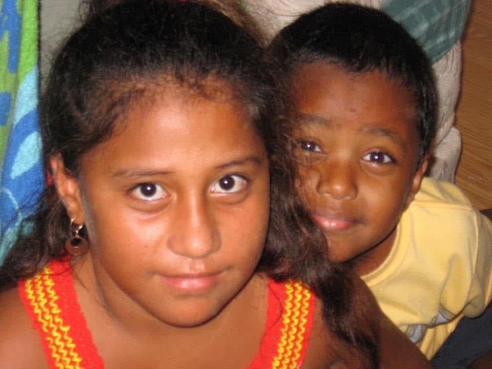 A close-up of a girl and a boy