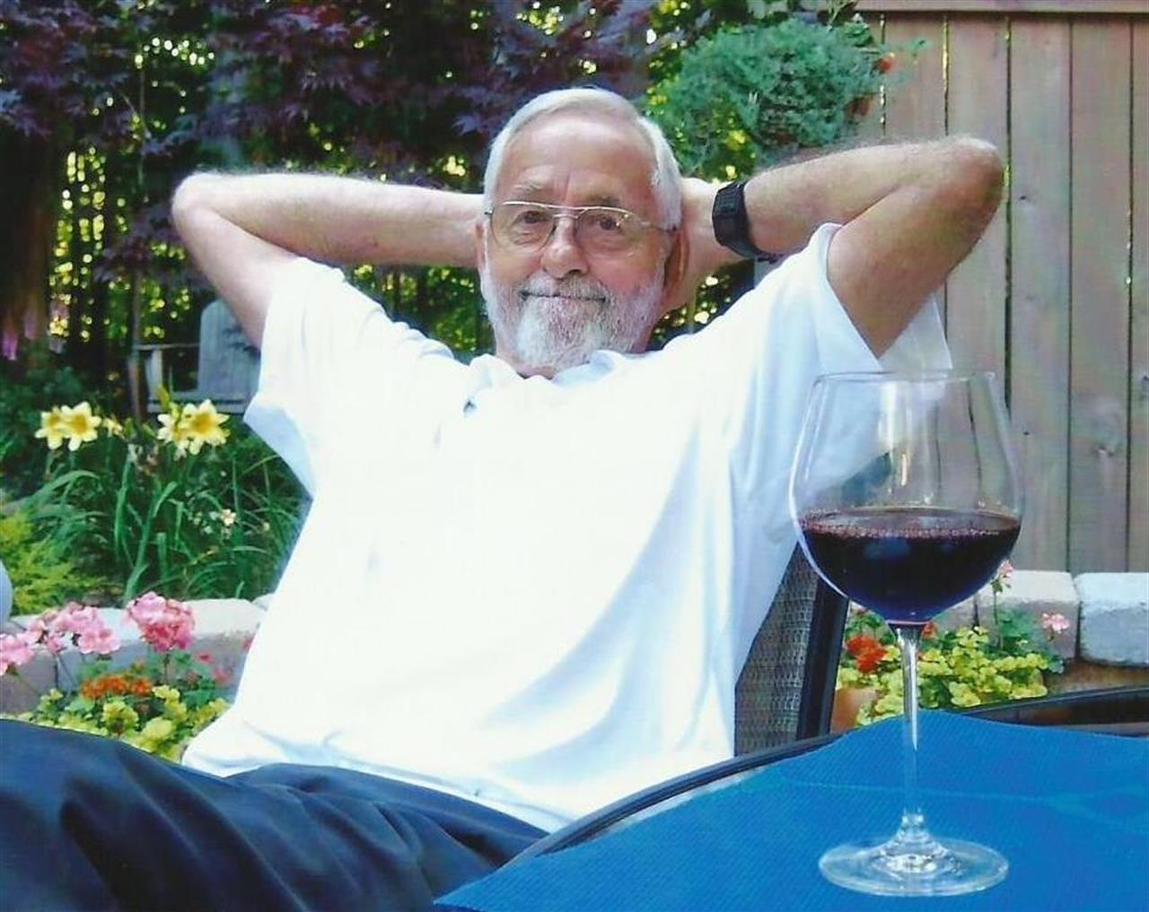 A man with his hands behind his head