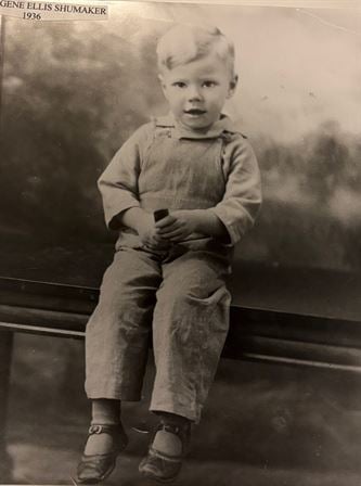 A child sitting on a bench