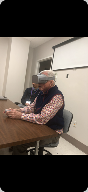 A man wearing a virtual reality goggles