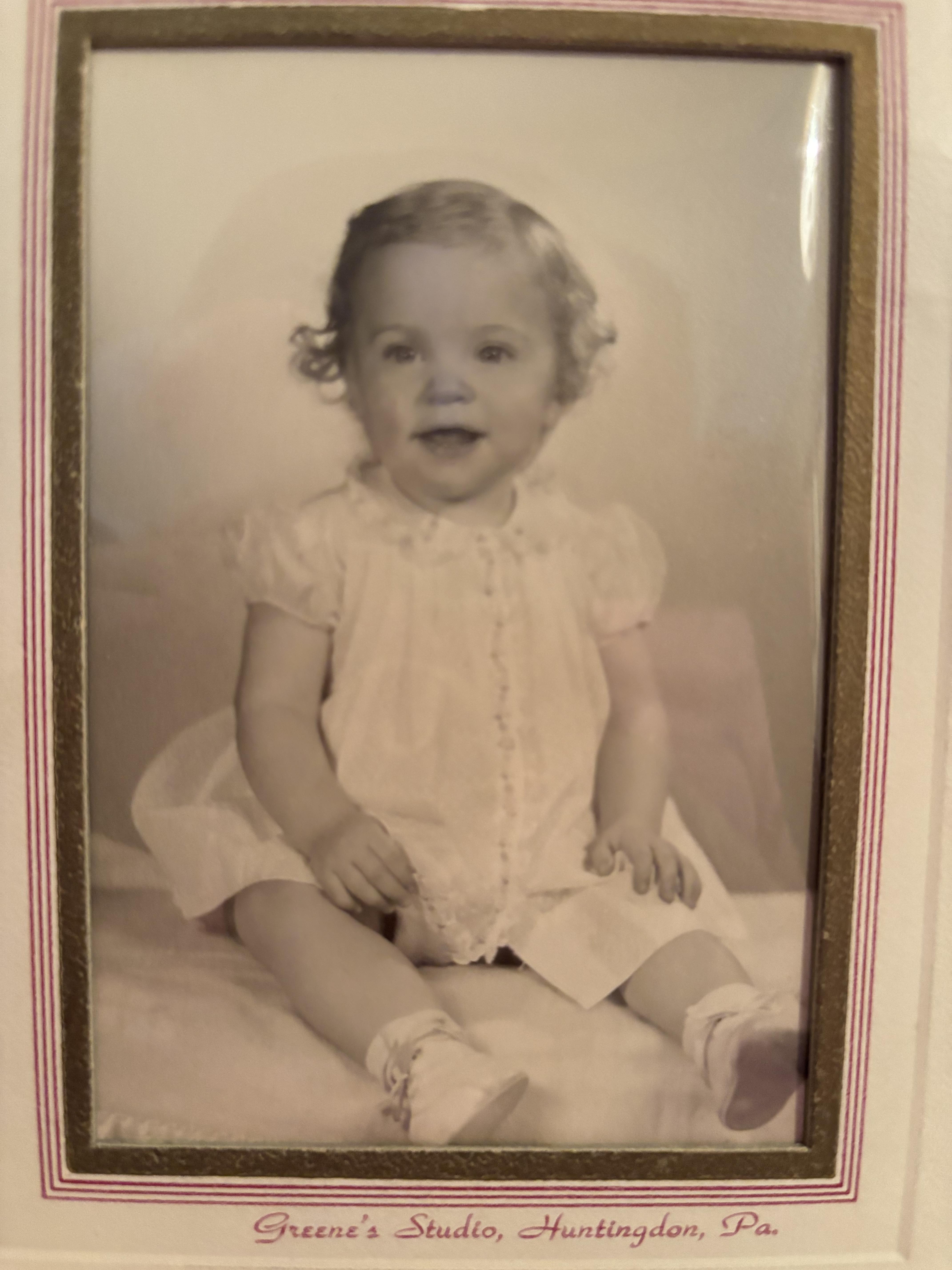 A black and white photo of a baby