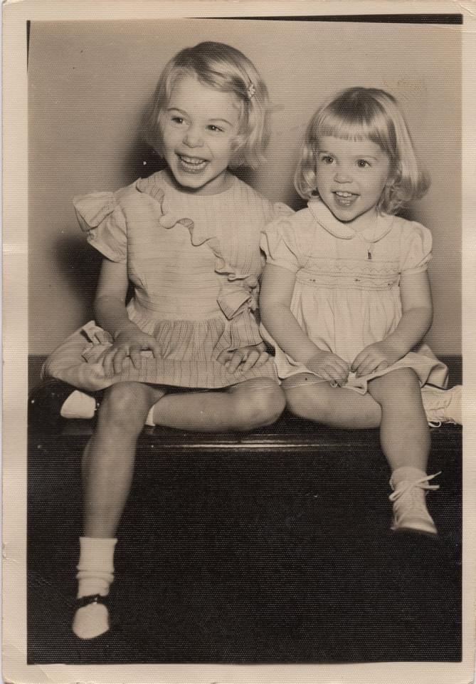 Two girls sitting on a bench