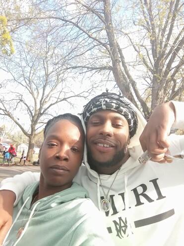 A man and woman taking a selfie
