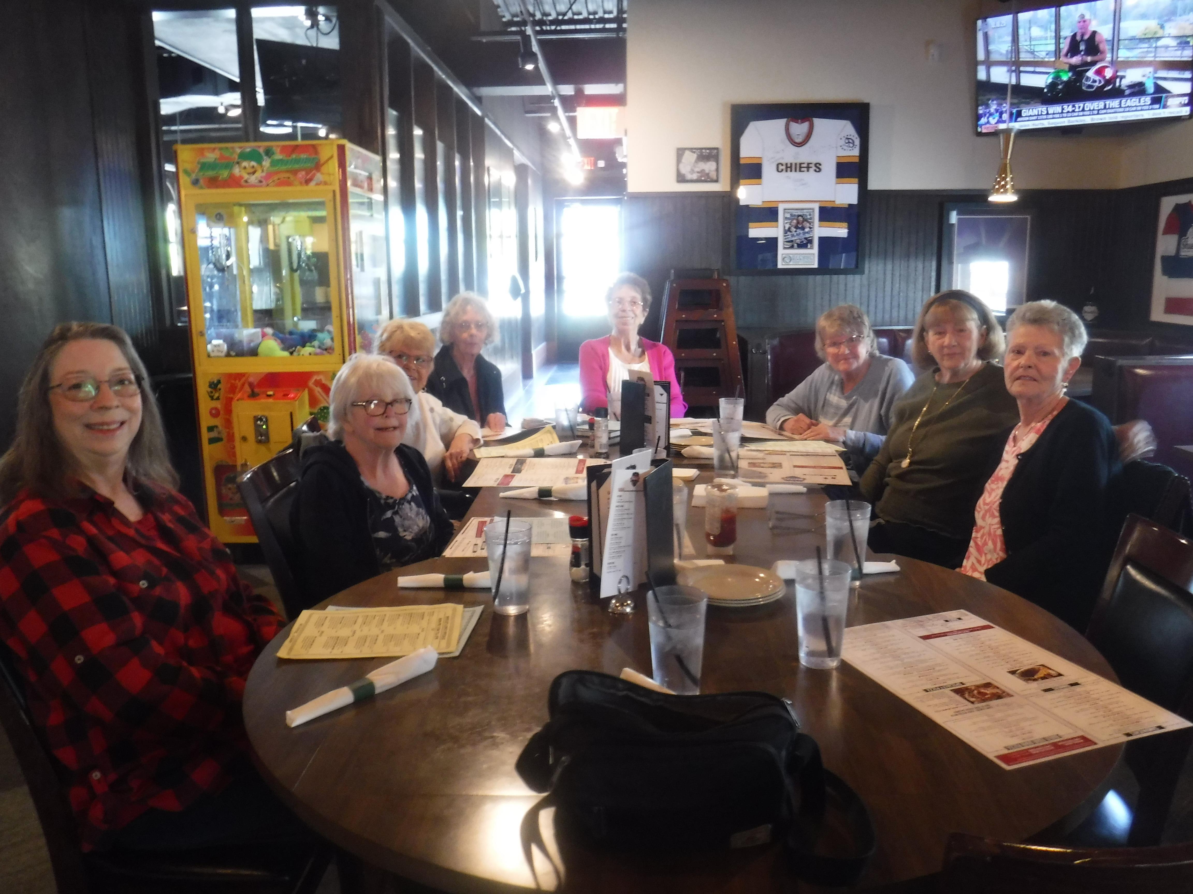 A group of people sitting around a table