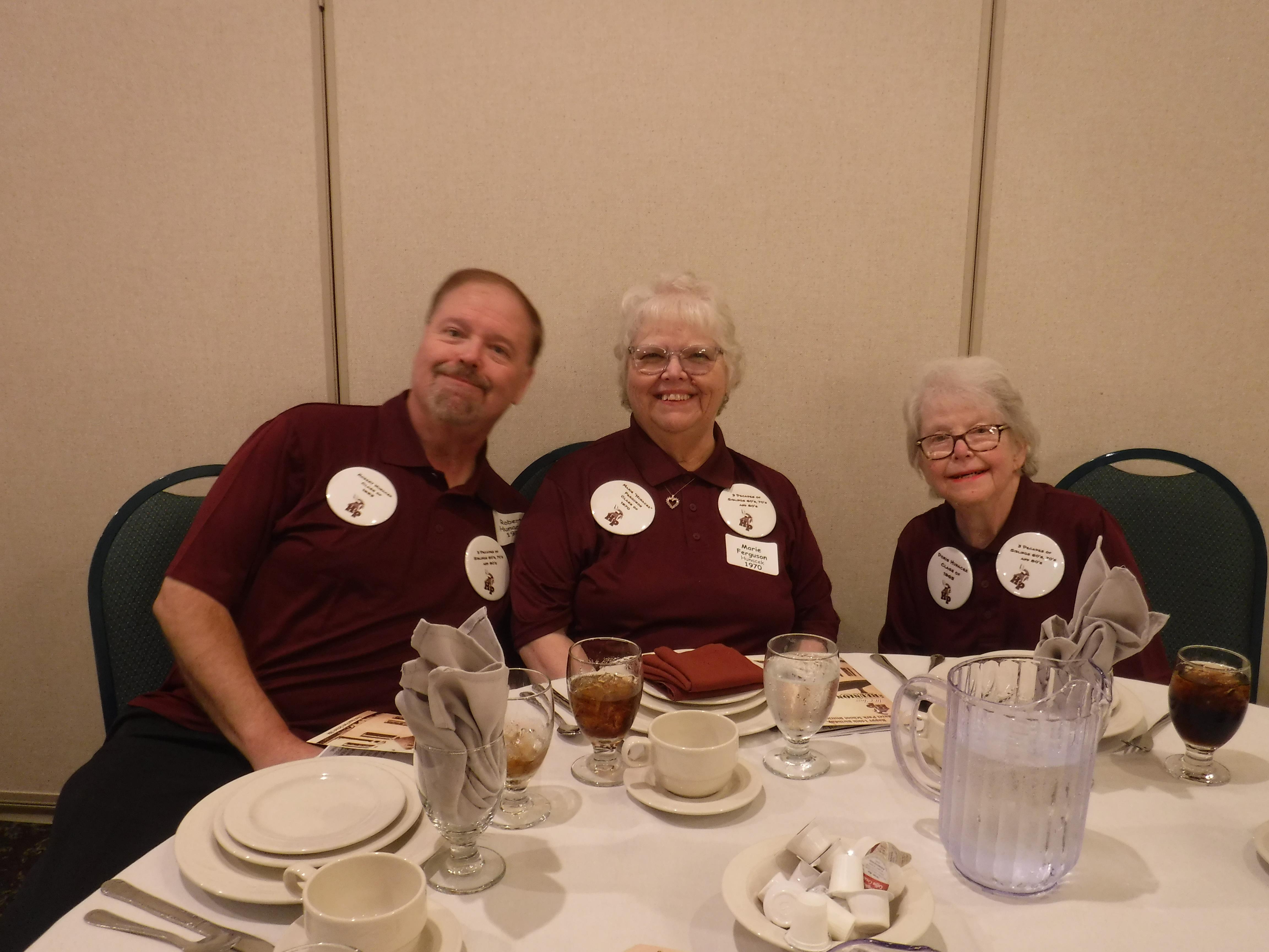 A group of people sitting at a table