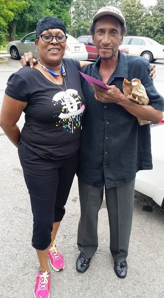 Two people standing together smiling