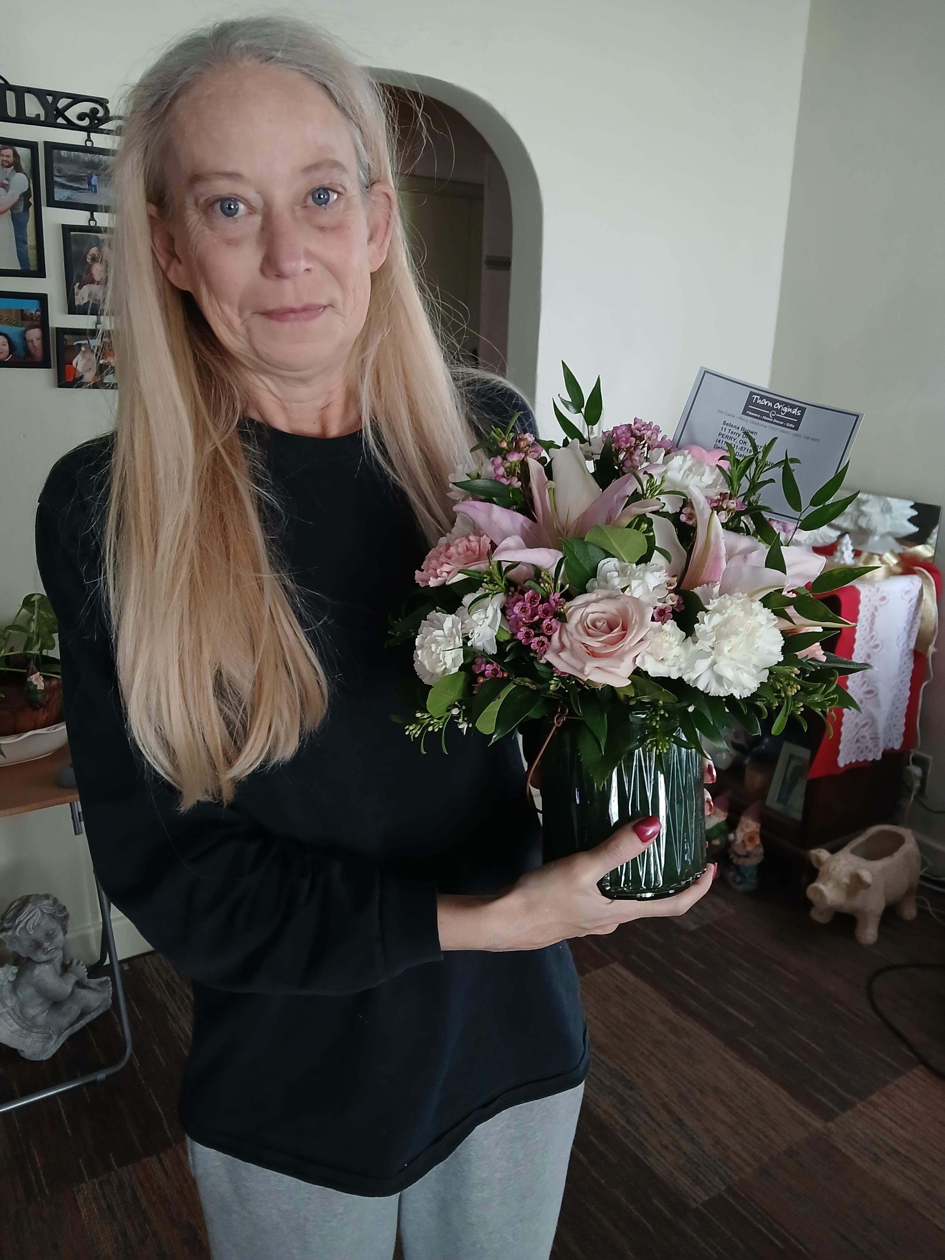 A woman holding a bouquet of flowers