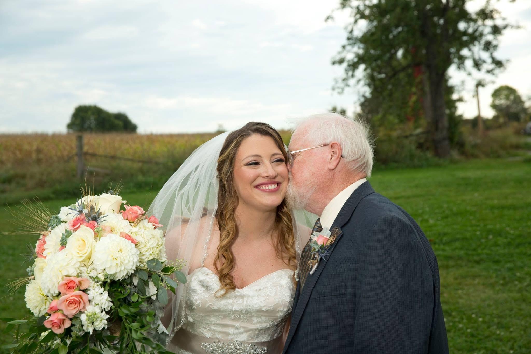 A man kissing a woman's cheek