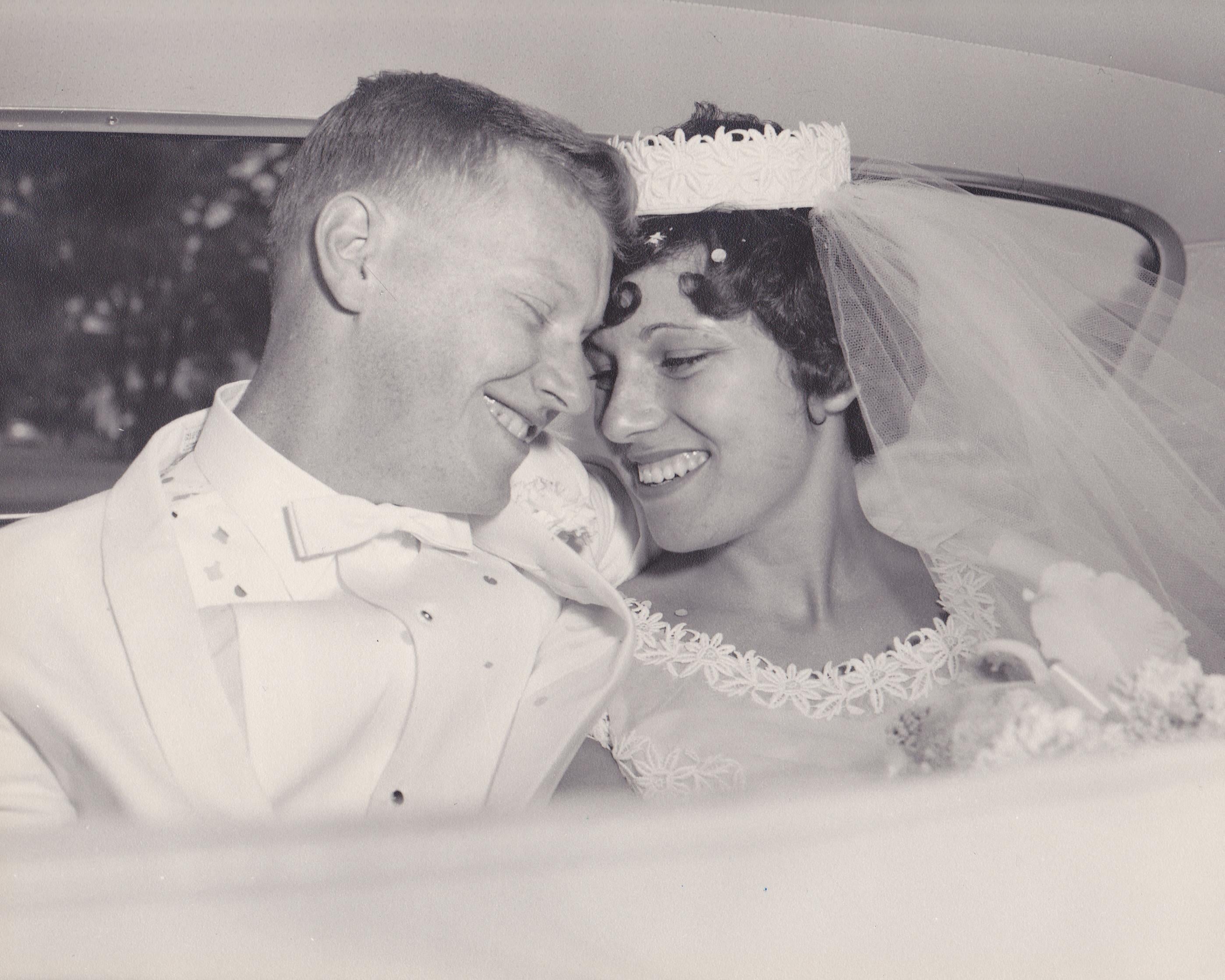 A man and woman in wedding attire