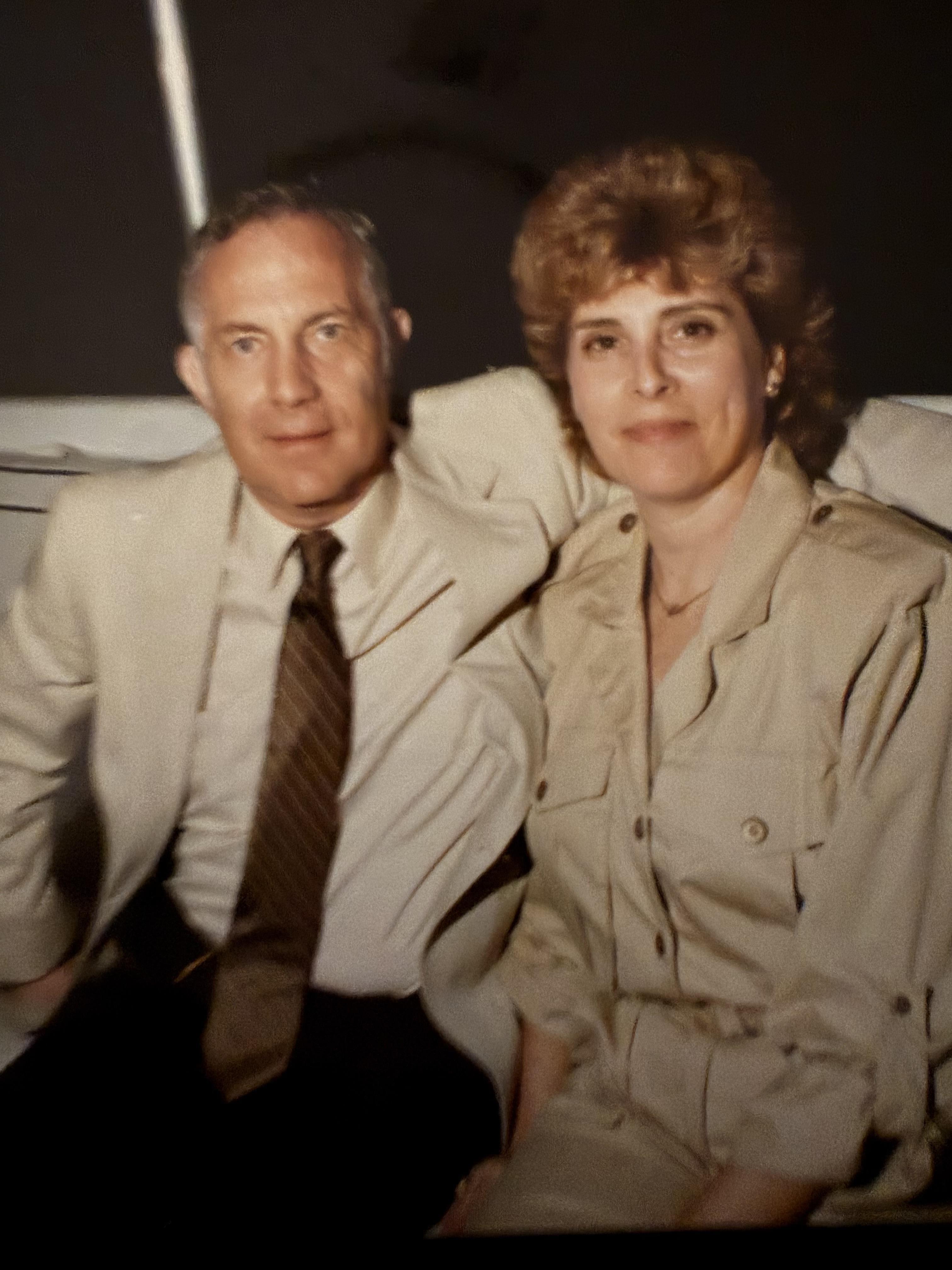 A man and woman sitting on a couch