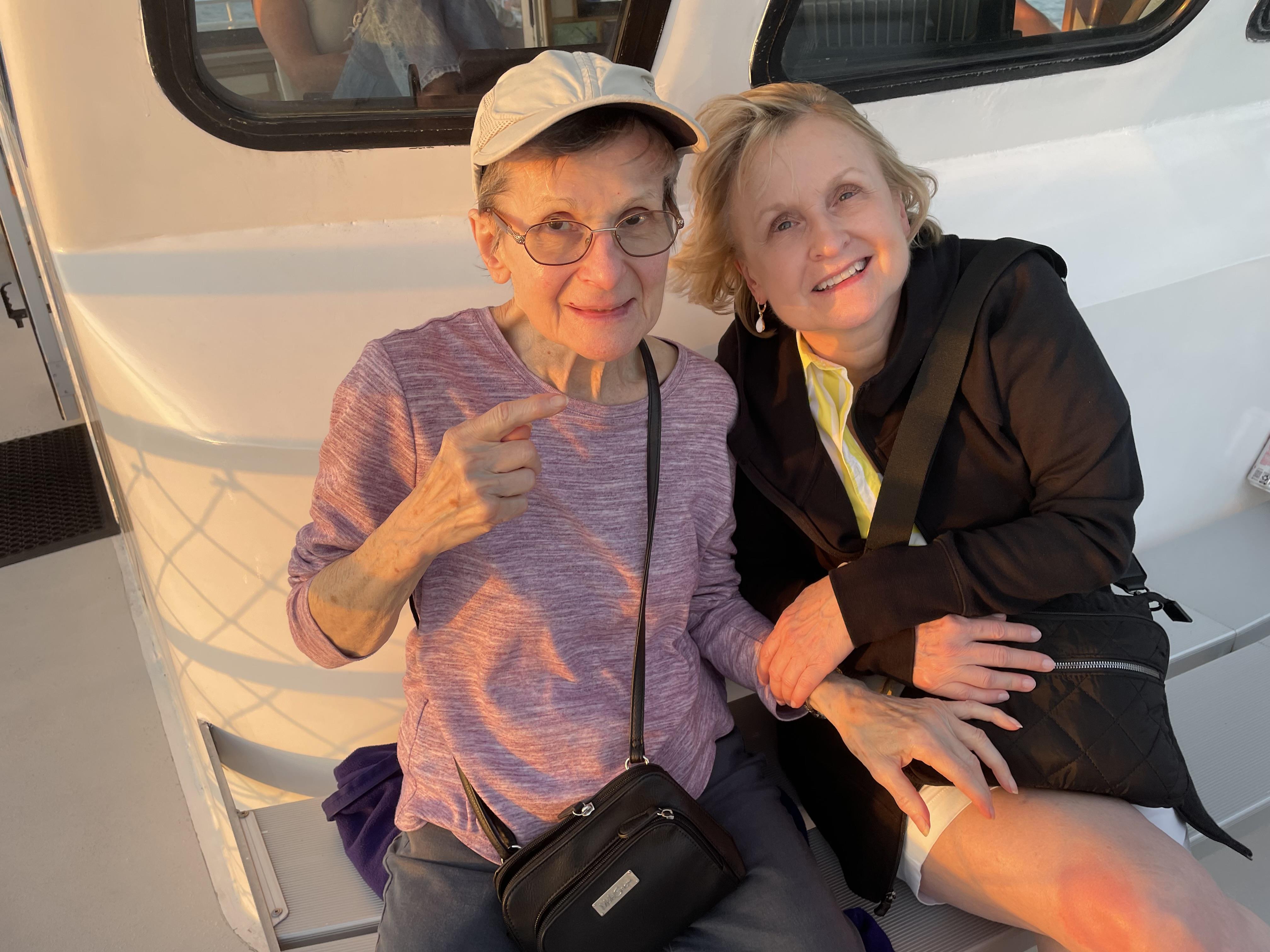 Two women sitting on a boat
