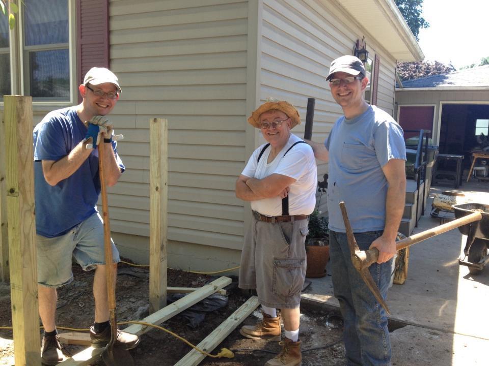 A group of people holding pickaxes