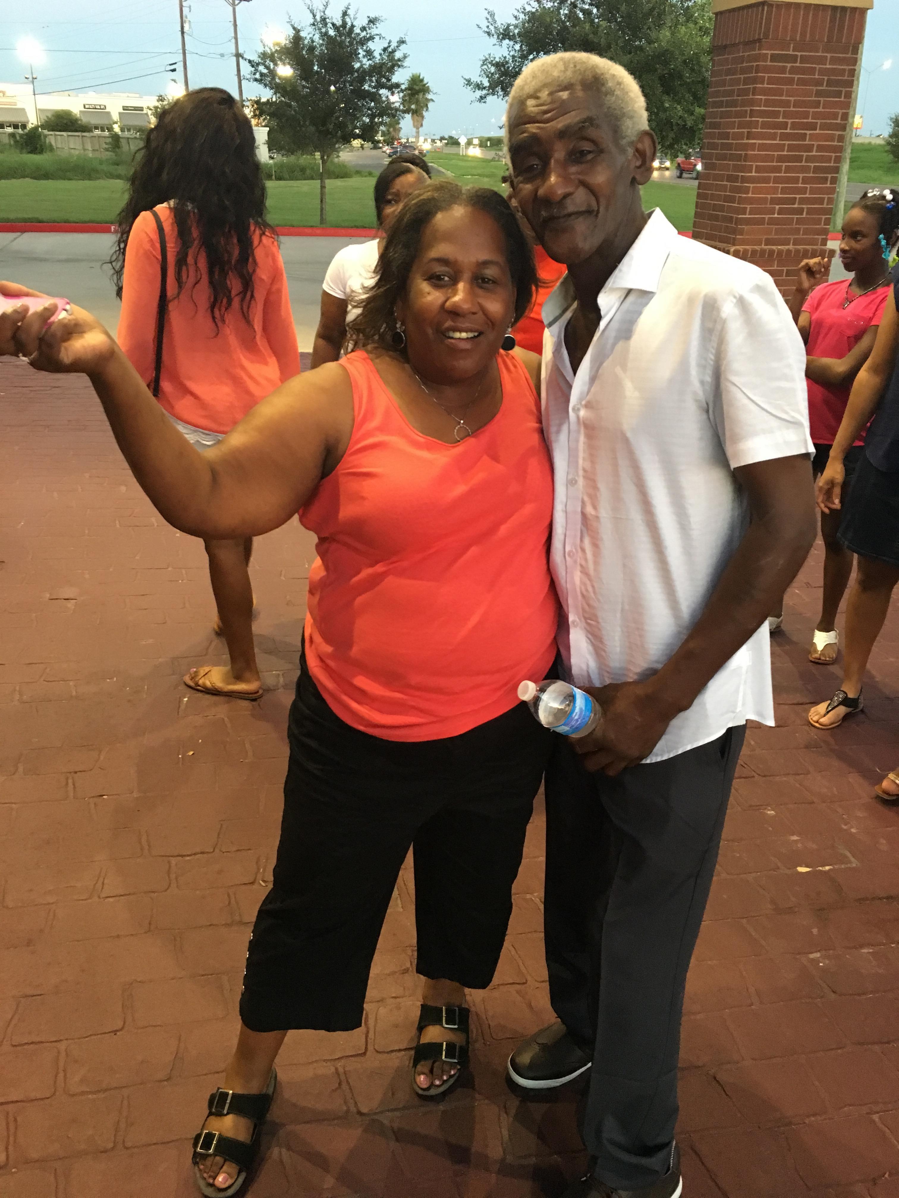 A man and woman posing for a picture