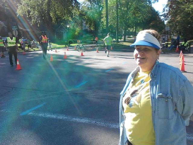 A woman standing in a parking lot