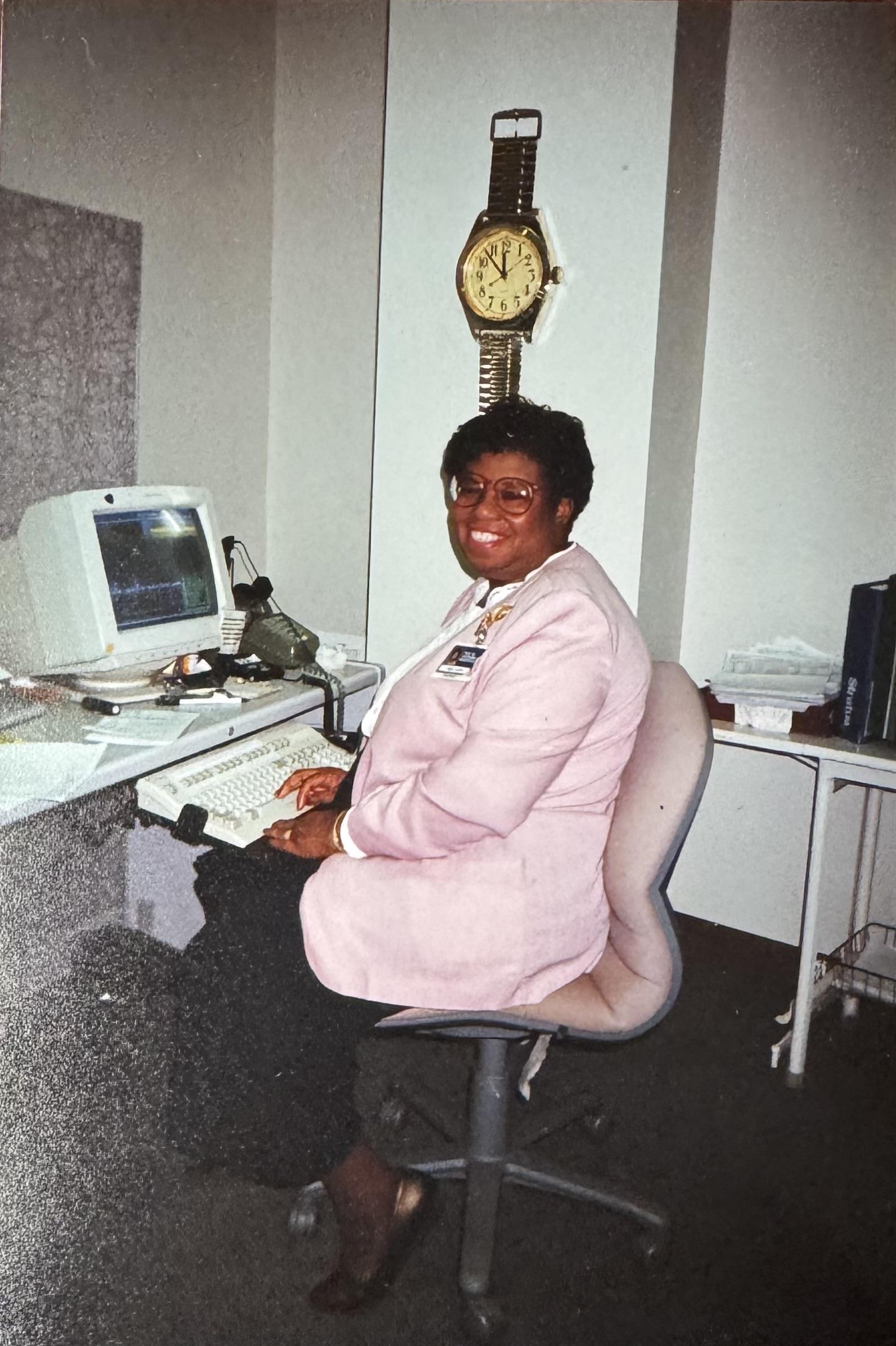 A woman sitting at a desk