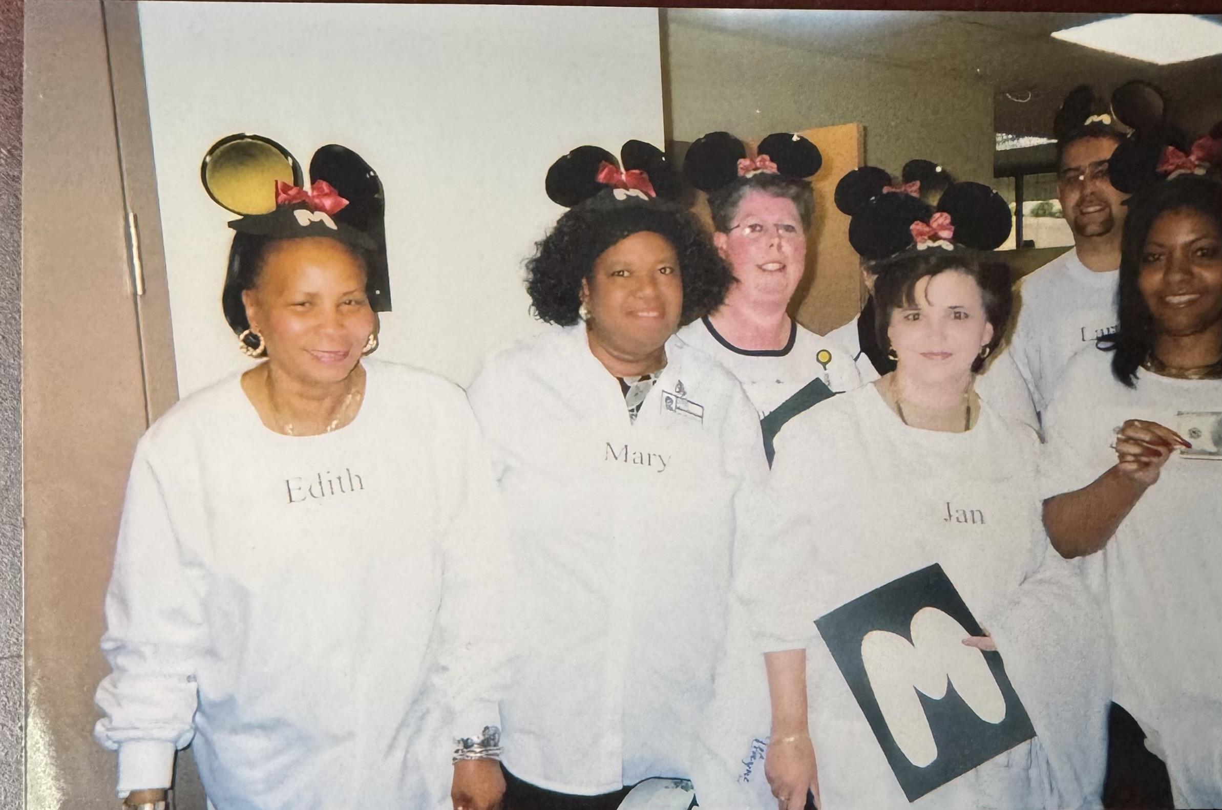 A group of women wearing mouse ears