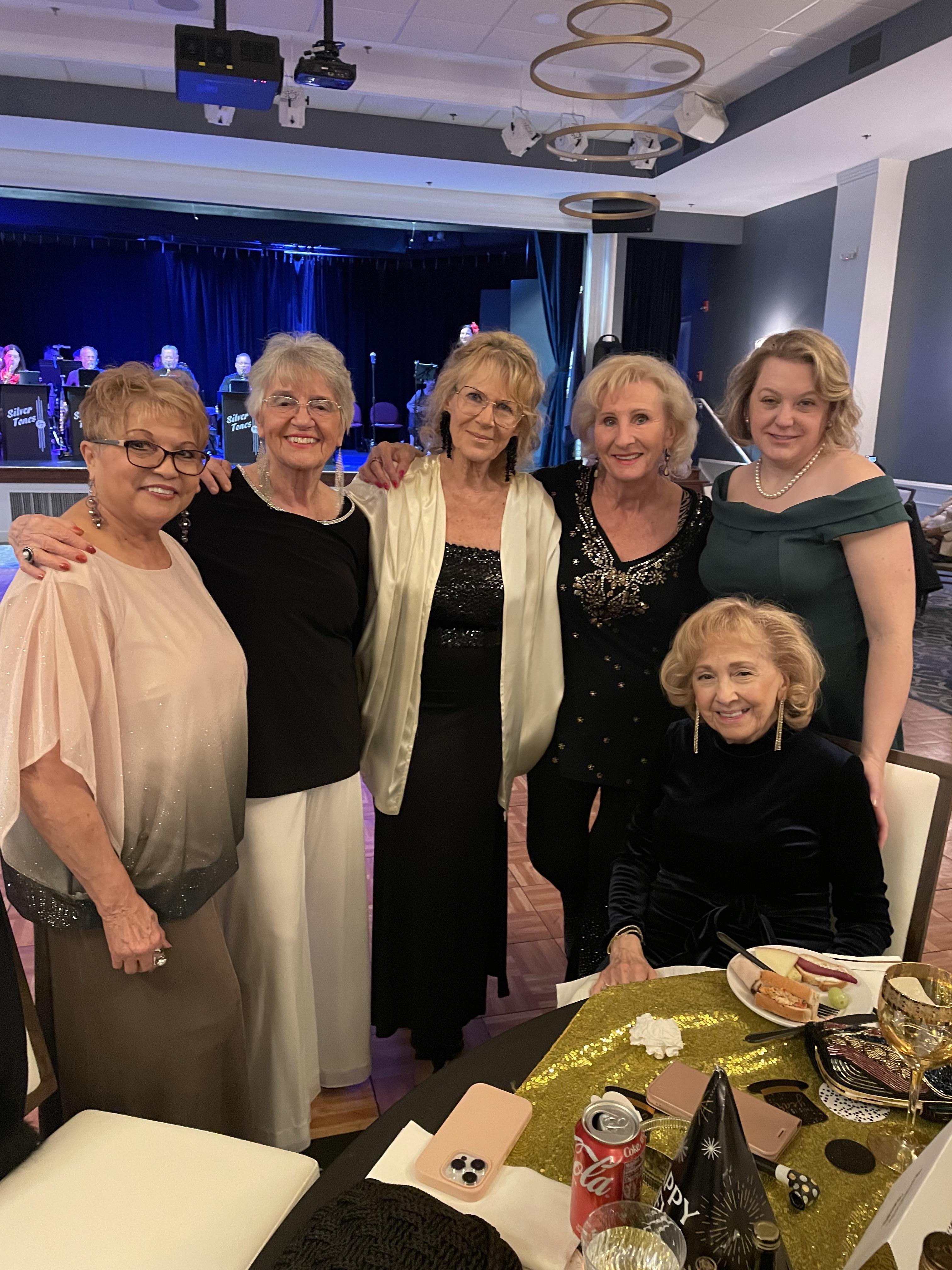 A group of women posing for a photo