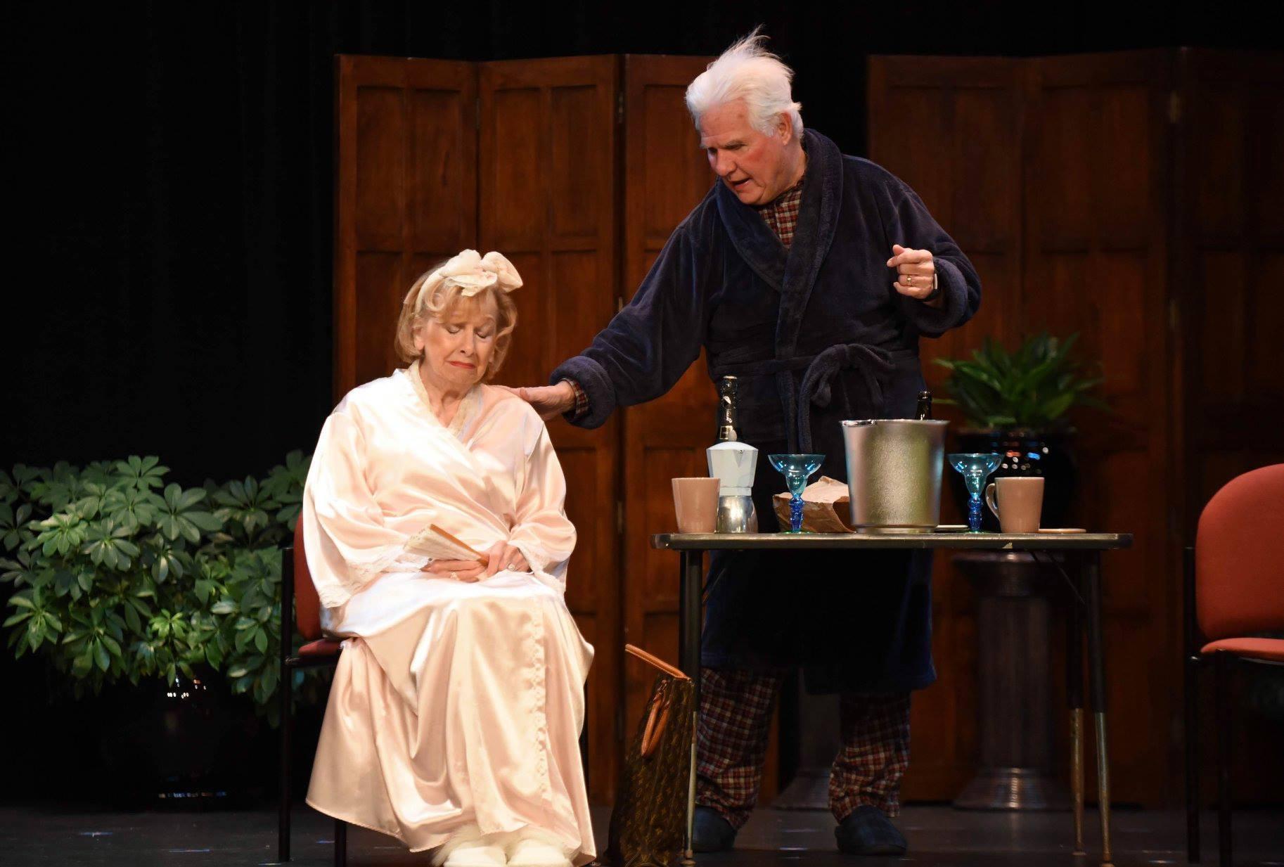 A man standing next to a woman
