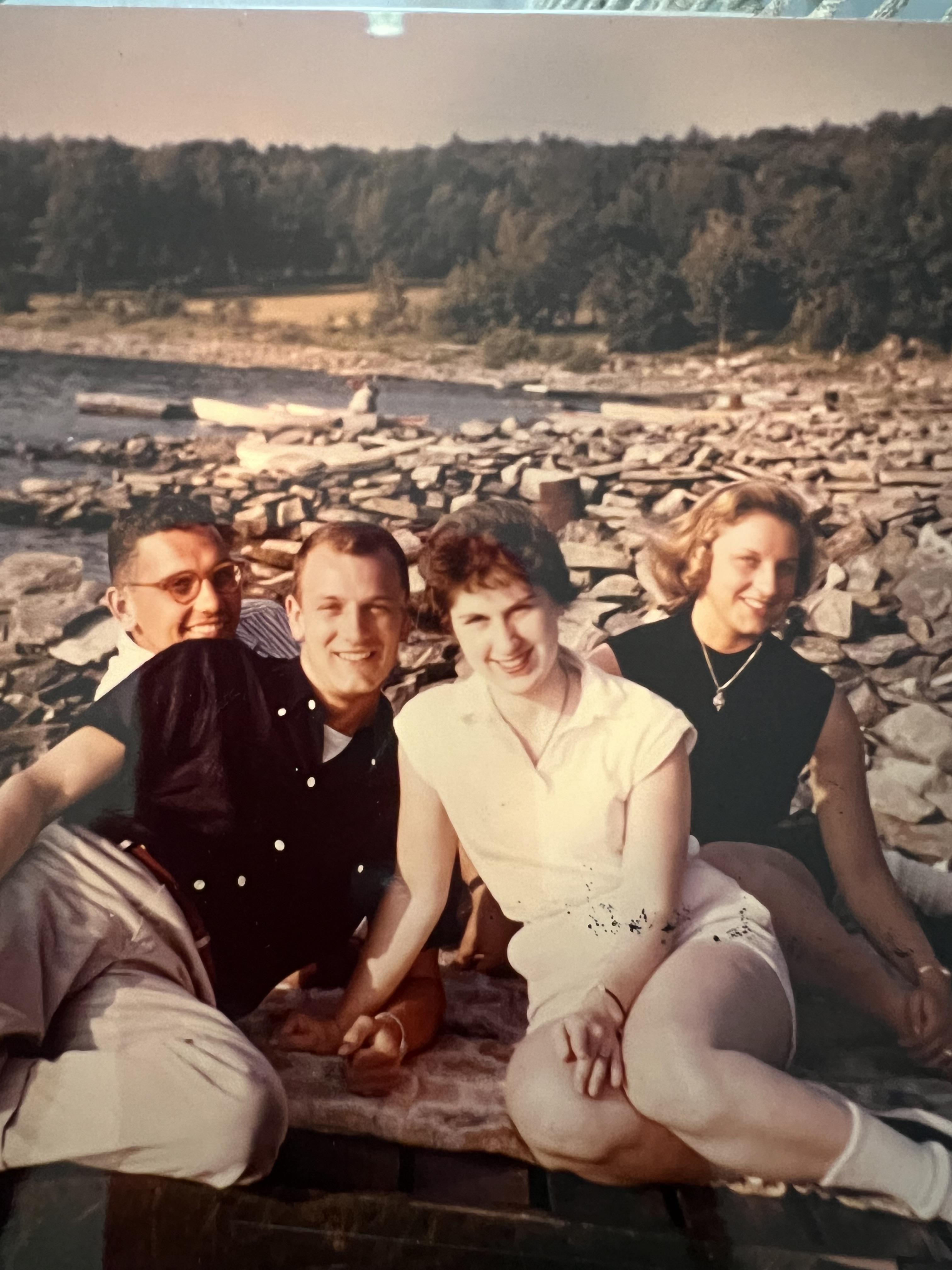 A group of people sitting on rocks
