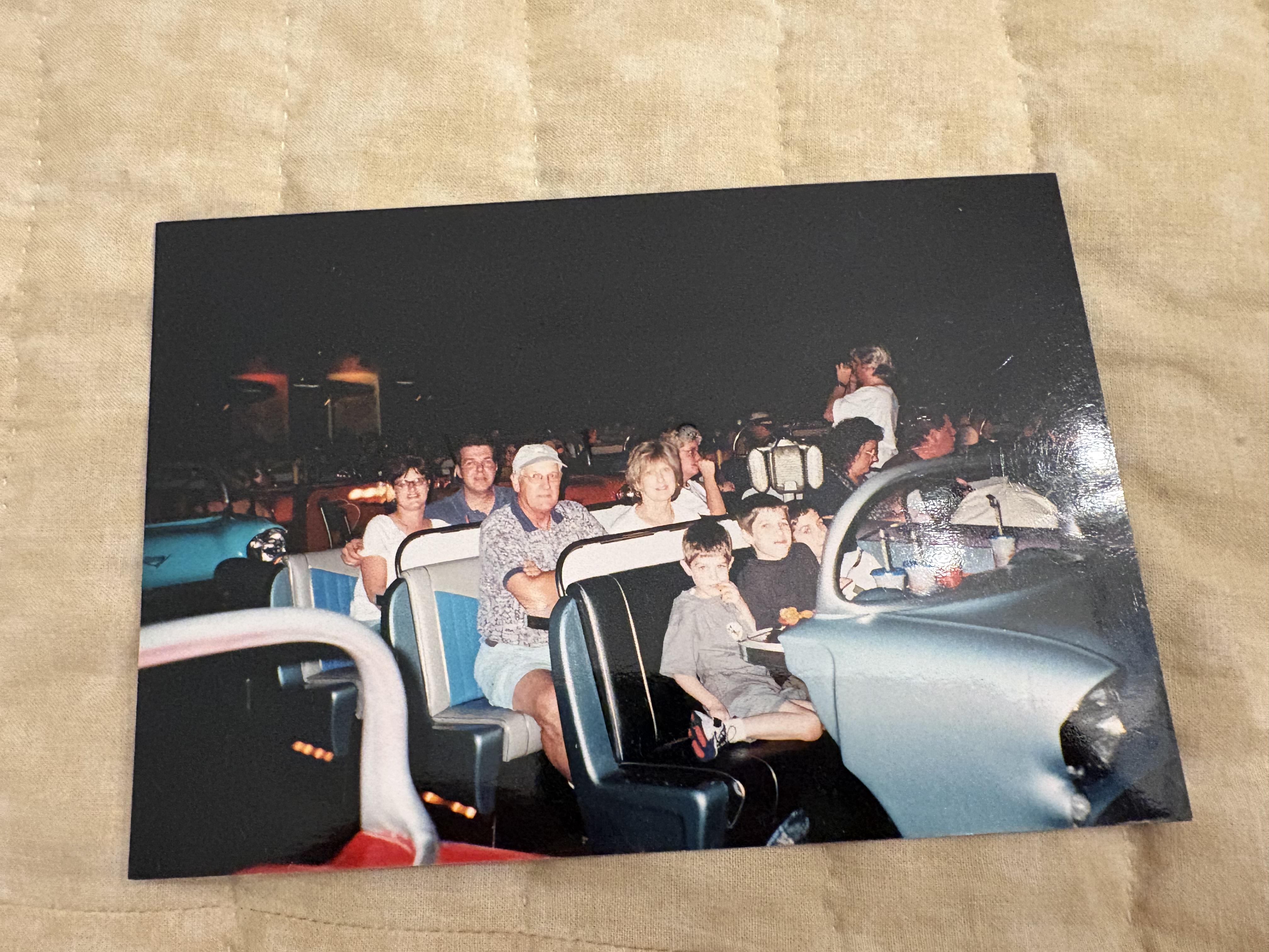 A group of people sitting in a car