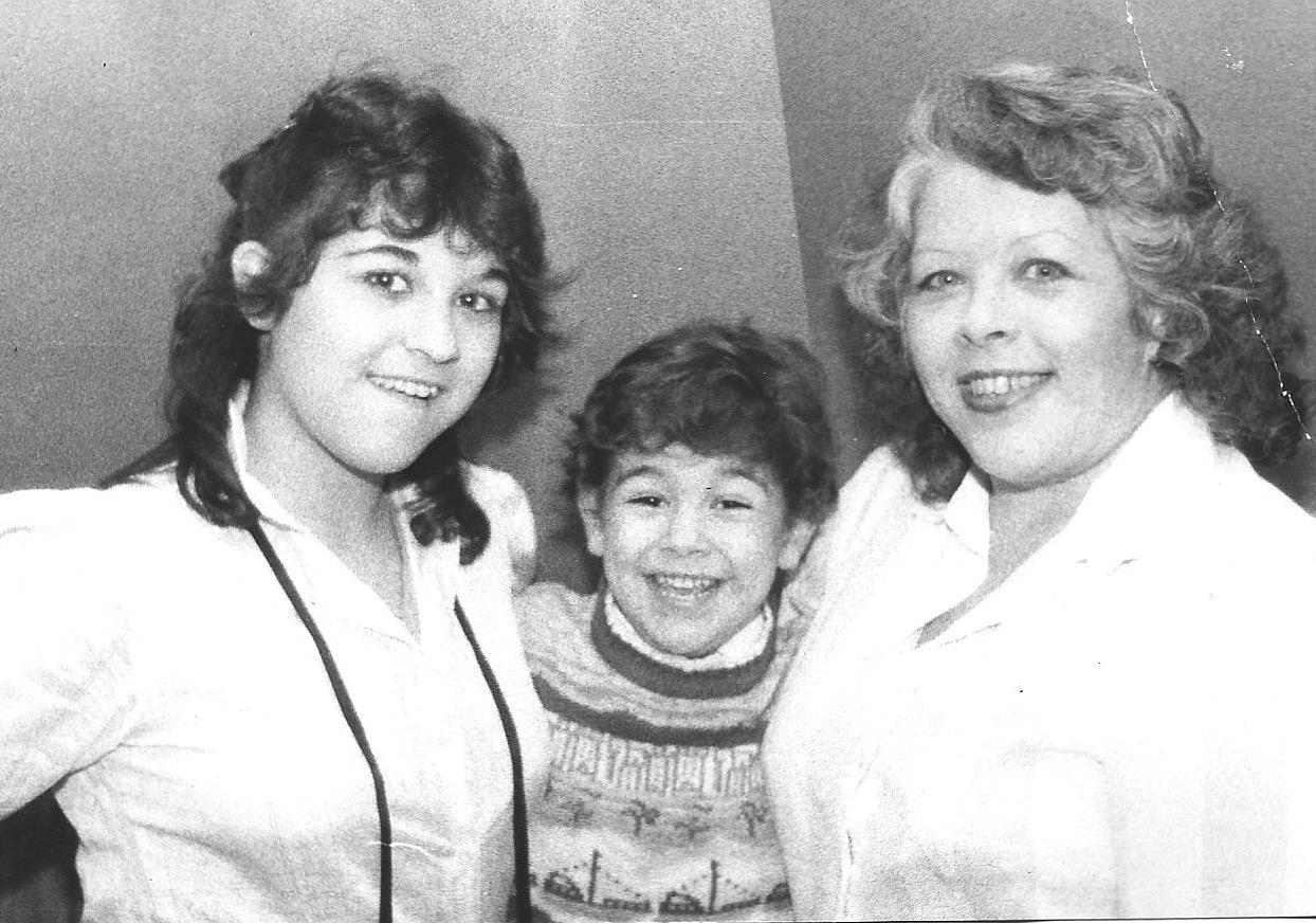 A group of women and a boy